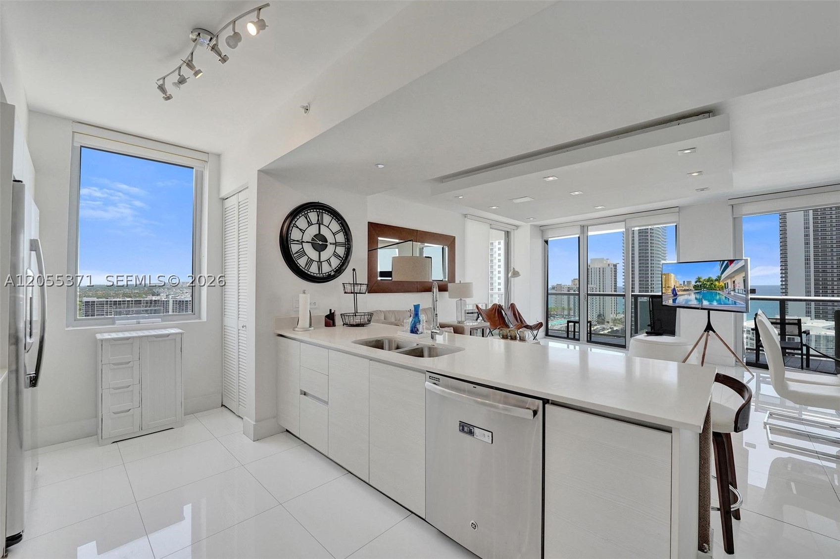 SPACIOUS CORNER 3-BEDROOM, 3-BATH RESIDENCE ON THE 19TH FLOOR OF BEACHWALK RESORT IN HALLANDALE BEACH. OFFERING APPROXIMATELY 1,711 SQ. FT. OF LIVING SPACE, THIS RESIDENCE FEATURES PRIVATE ELEVATOR ACCESS, FLOOR-TO-CEILING IMPACT WINDOWS, AN OPEN-CONCEPT LAYOUT, CUSTOM CABINETRY, A LARGE CENTER ISLAND, AND A 319 SQ. FT. WRAPAROUND BALCONY WITH VIEWS OF THE INTRACOASTAL WATERWAY, THE ATLANTIC OCEAN, AND THE CITY SKYLINE. AN EXCELLENT OPPORTUNITY AS A LUXURY RESIDENCE, VACATION HOME, OR INCOME-PRODUCING INVESTMENT. NO RENTAL RESTRICTIONS ALLOW FOR SHORT-TERM RENTALS, INCLUDING AIRBNB. RESORT-STYLE AMENITIES INCLUDE TWO POOLS, A ROOFTOP POOL, FITNESS CENTER, VALET PARKING, 24-HOUR SECURITY, ON-SITE RESTAURANT, CONCIERGE SERVICES, AND BEACH ACCESS. MAINTENANCE INCLUDES ELECTRICITY, WATER, CABLE, INTERNET, PHONE SERVICE, AND BUILDING INSURANCE. IDEALLY LOCATED JUST STEPS FROM THE BEACH AND MINUTES FROM GULFSTREAM PARK, AVENTURA MALL, SHOPPING, DINING, AND MAJOR HIGHWAYS.