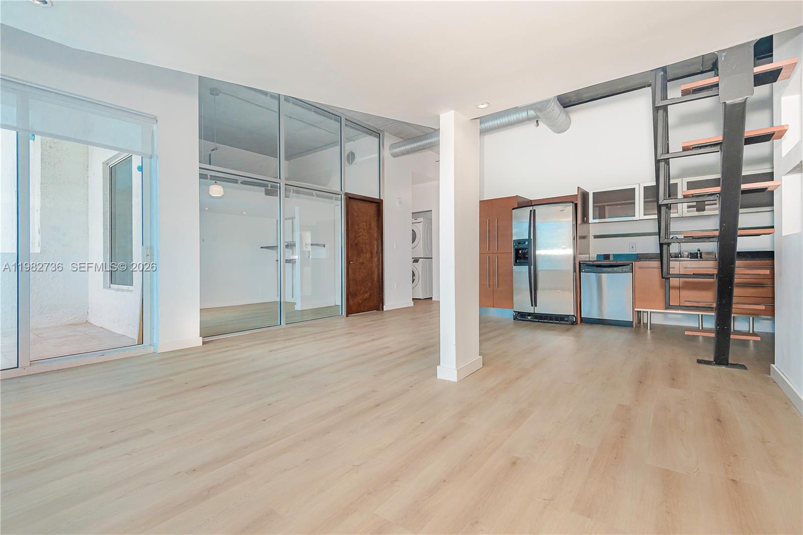 Attention Investors and Urban Lifestyle Buyers! This income-producing condo, rented for $2600/month through 7/31/27, is being sold subject to the existing lease, offering immediate rental income. Located along the scenic Miami River in Neo Lofts, this bright and unique residence features 782 SF of living space, 9-ft ceilings, and large windows that fill the home with natural light.

A built-in mezzanine offers flexible space for a guest sleeping area or additional storage, while the built-in desk nook is perfect for a home office. The bedroom features a modern glass enclosure with privacy shades, maintaining the loft aesthetic while providing privacy when needed.

Recent upgrades include commercial-grade vinyl flooring throughout and a refrigerator and dishwasher installed in 2025. Step outside to the oversized private balcony and enjoy beautiful Miami River and city skyline views.

The unit also includes two assigned parking spaces and an additional storage unit, both valuable features in this area.

Residents of Neo Lofts enjoy resort-style amenities, including an Olympic-size pool, fitness center, tennis courts, meditation garden, dog park, business center, conference room, party room, on-site restaurant, and 24-hour concierge service. Ideally located with easy access to Downtown Miami, Brickell, and major highways.