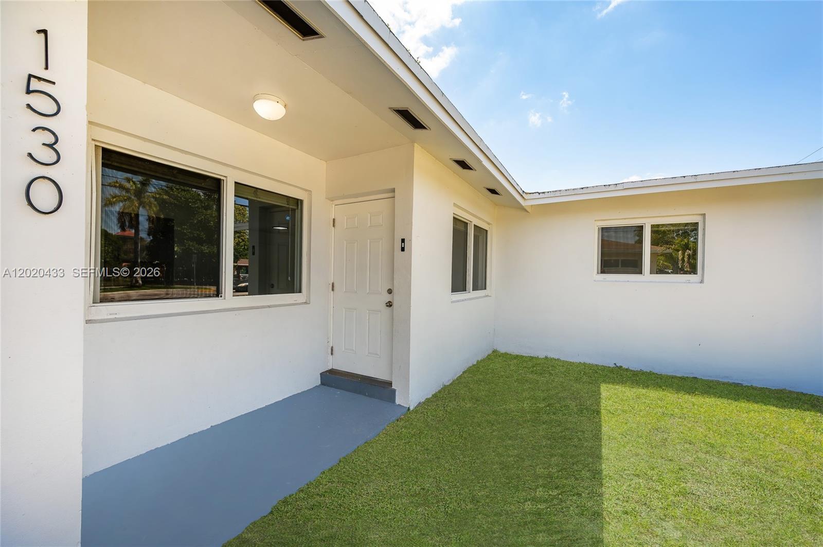 Beautifully renovated waterfront home featuring 3 bedrooms and 2 bathrooms, completely remodeled with modern upgrades throughout. This stunning residence includes a new electrical panel and wiring, impact doors and windows for enhanced security and peace of mind during hurricane season, modern LED lighting, updated kitchen and bathrooms, new appliances, laminate flooring, window blinds, and an included washer and dryer. The home has been freshly painted inside and out, and was professionally tented for termites in January 2024. Enjoy a bright and spacious layout with peaceful canal views and true move-in-ready comfort. Situated on a generously sized lot offering added privacy. Call for more information. See broker remarks.