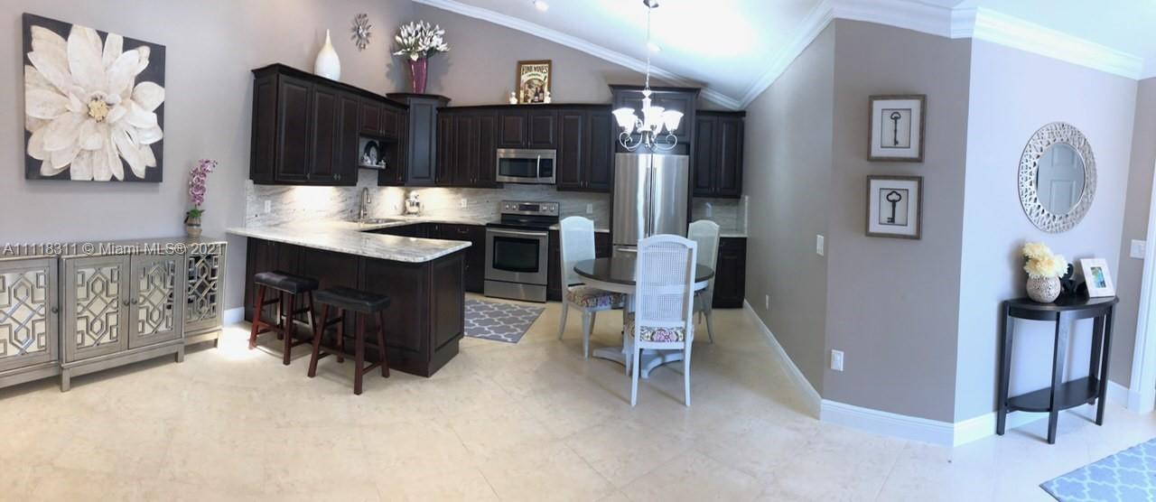 Townhouse is completely renovated. Kitchen features plenty of cabinets with stainless steel appliances. Lots of high hats and crown molding throughout. Screened in concrete patio area. Please call 561-951-1347 and ask for Jason.
