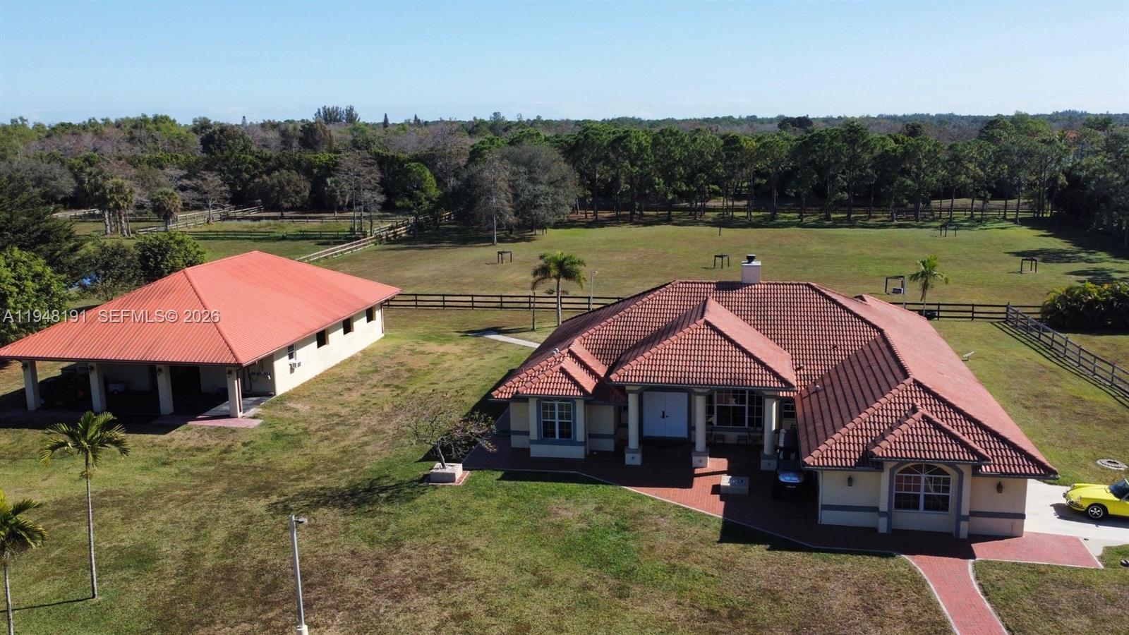 A rare opportunity is offered to own a beautiful property in the heart of Loxahatchee. Nestled on a quiet street surrounded by nature, this large 4 bedroom, 2 bath home offers the perfect balance of privacy, space, and convenience. Enjoy the peaceful, rural lifestyle Loxahatchee is known for while still being just minutes from shopping, dining, schools, and major roadways. Over 5 acres! The property features expansive outdoor space ideal for entertaining, gardening, animals, or simply enjoying Florida’s natural beauty. Whether you’re seeking room to grow, space for recreational vehicles, or a tranquil retreat from city life, this property delivers endless possibilities.  Includes detached barn / stable.