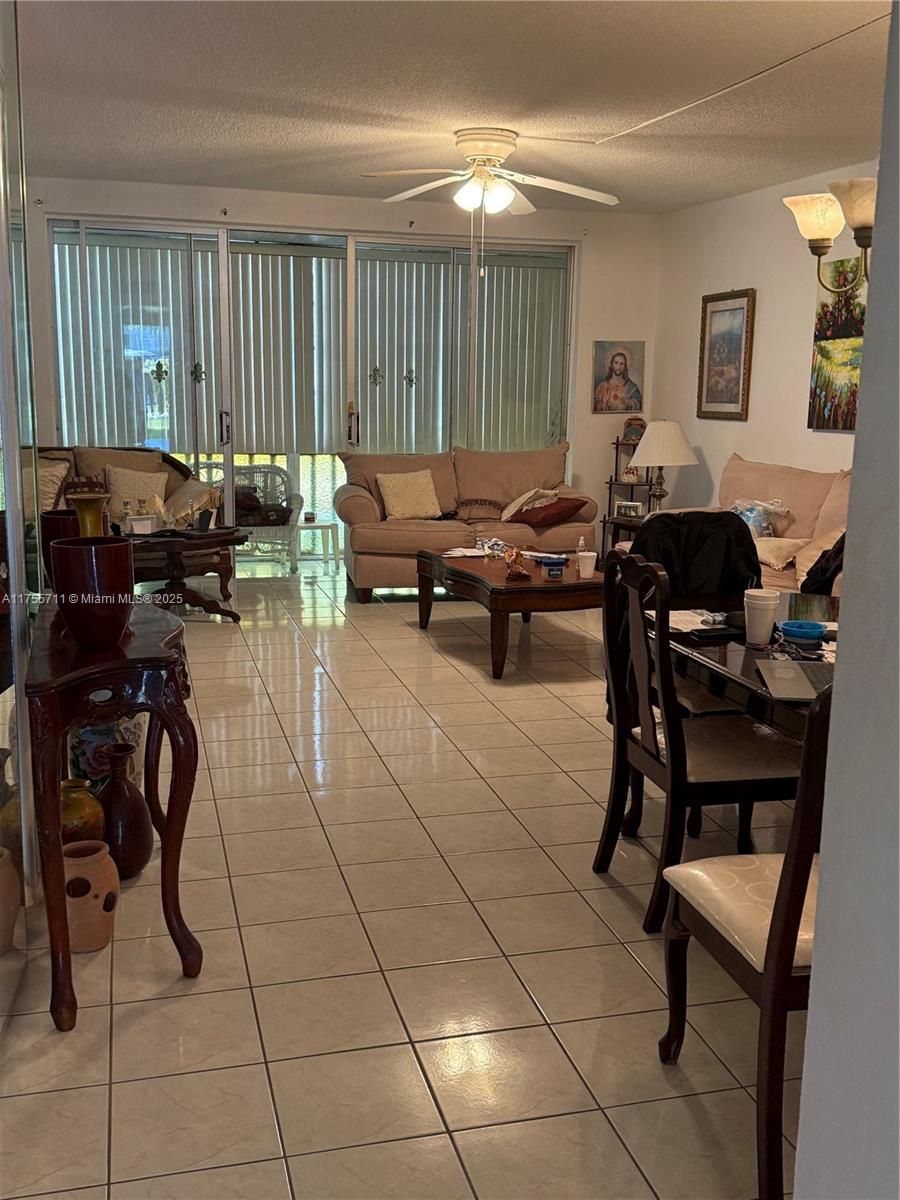 LOCATION, LOCATION, LOCATION     Opportunity in a 55+ Community with Very Low Maintenance Fees! Conveniently located just steps away from Skylake Mall, where you'll find supermarkets and a variety of services. This spacious and bright apartment is perfect for those seeking comfort, tranquility, and plenty of natural light. With an excellent layout, the apartment features a charming enclosed balcony. The generous interior spaces include abundant closets. All windows are equipped with accordion hurricane shutters. Enjoy access to the sidewalk along the lake. The building offers two swimming pools, one of which is heated, providing year-round enjoyment. here! Don’t miss the chance to live in a place that combines comfort and convenience.