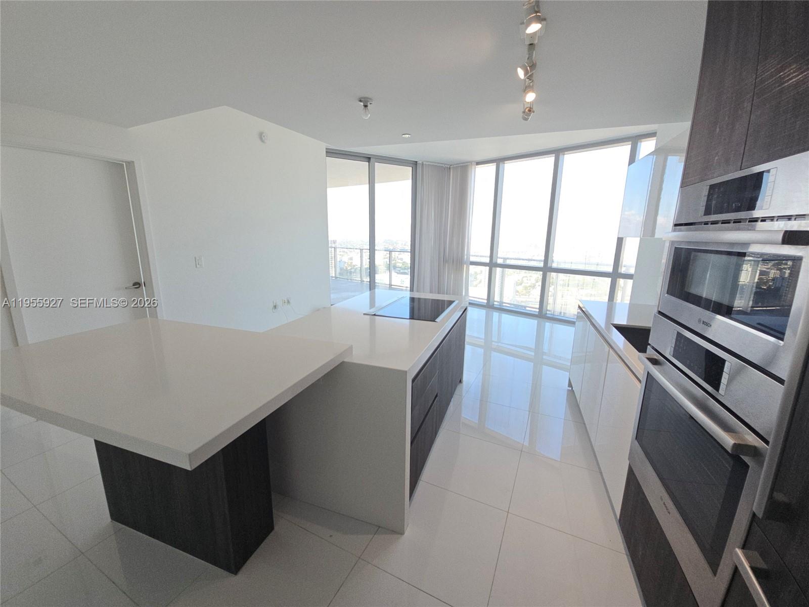 Experience the pinnacle of urban elegance in this beautifully furnished residence at the Iconic Paramount Miami Worldcenter. Spanning 1,185 square feet, unit 4604 offers a seamless blend of modern design and functional luxury.
Residence Highlights:
Flexible Layout: A spacious 1-bedroom suite plus a versatile den that functions perfectly as a private home office or a welcoming guest room.
Sophisticated Finishes: Arrive through a private foyer into a bright living space featuring floor-to-ceiling windows and premium ceramic tile flooring.
Gourmet Kitchen: Equipped with top-tier appliances, sleek cabinetry, and a modern aesthetic designed for entertaining.
Primary Suite: Retreat to a sanctuary featuring a generous walk-in closet and spa-like bathroom finishes.
Living at Paramount means access to world-class, resort-style amenities, including a state-of-the-art fitness center, basketball courts, a heated pool, and lush outdoor lounge areas.
Located in the vibrant heart of Downtown Miami, you are steps away from the Kaseya Center and Frost Museum, with the elite shopping and dining of the Design District, Brickell, and South Beach just minutes from your door.