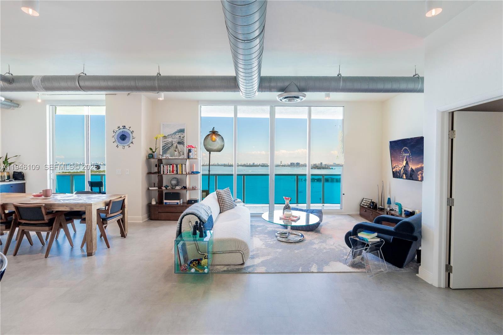 Beautifully renovated residence at Star Lofts featuring sweeping, unobstructed views of Biscayne Bay from every room. Over $100k in upgrades include a completely renovated primary bathroom, upgraded guest bathroom, custom built primary closet, and additional built-in storage in the primary bedroom. The living space includes a beautifully designed bar with a 128-bottle wine fridge perfect for entertaining. Bar area also features extensive storage with custom cabinetry. Smart-home features include a Nest air controller, and automatic blinds in the living space and blackout blinds in the primary bedroom. Includes one assigned parking space, storage space can be rented monthly from the building directly. Ideally located in Edgewater, one of Miami’s fastest-growing waterfront neighborhoods, just minutes from Wynwood, Midtown, the Design District, Downtown Miami, and Miami Beach, with easy access to dining, shopping, parks, and major highways.