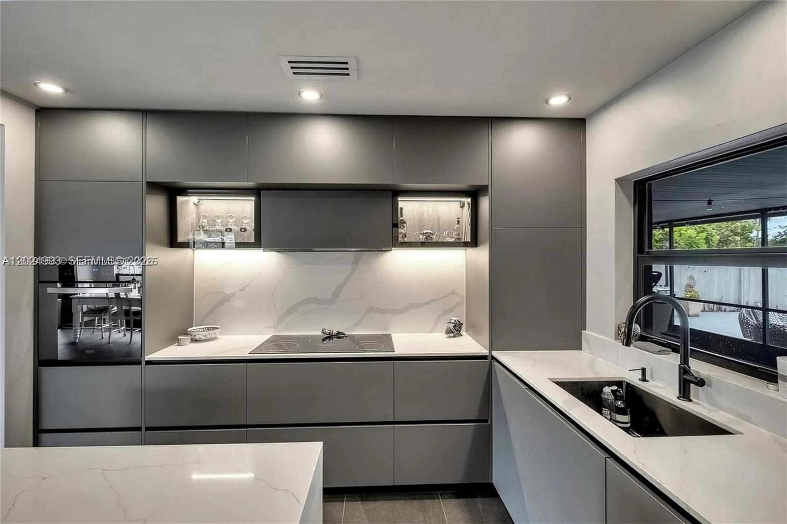 Fully remodeled modern pool home in the Oakland Park / Fort Lauderdale area. This 3-bedroom, 2-bath residence features Italian porcelain flooring, a custom-designed kitchen with high-end appliances, soft-close cabinetry, updated electrical, newer central A/C, and upgraded pool equipment. The home offers an open layout with a flexible family room, modern finishes throughout, and a private backyard with pool, BBQ area, and space to entertain. Currently leased at $3,800/month plus $200/month landscaping through December, making this a great opportunity for investors seeking immediate rental income or buyers planning ahead. Property is being sold AS IS. Seller prefers a clean transaction and does not intend to make repairs. Tenant occupied. Showings require 24-hour advance notice. Do not disturb tenants.