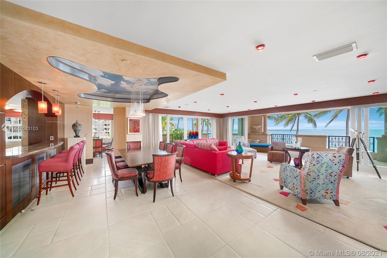 This beautiful second floor, 2BR/2+1BA Oceanfront unit offers 3,310 SF of luxury as you relax and listen to the ocean and feel the breeze from an expansive wraparound terrace with direct unobstructed ocean views. An elegant entry foyer leads to open living, dining, and family areas with direct terrace access and telescoping sliding glass doors that open to fully experience true indoor/outdoor living as its finest. Large eat-in kitchen w/top-of-the-line appliances and a separate breakfast area. Features 2 spacious principal suites with terrace access and rich hardwood floors, plus 2 principal bathrooms with dual sinks, walk-in closets, glass showers and sunken spa tubs. The beach and ocean are just outside your terrace plus 5-Star-Fisher Island amenities complete this amazing unit.