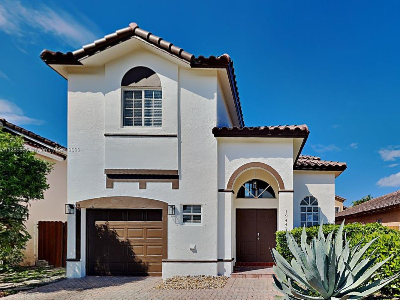 The front exterior boasts a car garage and a covered entrance, while the fenced backyard offers a patio area for your outdoor enjoyment. Inside, you'll find features like luxury vinyl plank flooring, an open living area, and large windows that bring in lots of natural light throughout. Cook up delicious meals in the kitchen, equipped with stainless steel appliances, all white cabinetry, and quartz countertops. The spacious bedrooms match the chic, modern style of the home and come with built-ins in the closets. Each bathroom is equipped with stylish fixtures giving you a perfect backdrop for your at-home spa day.