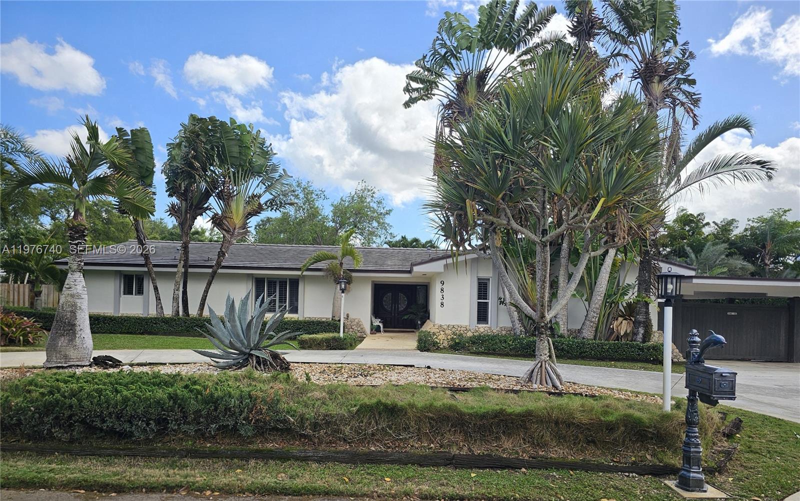 Welcome to this luxurious one-story residence located in an upscale and highly desirable neighborhood. This expansive 5-bedroom, 3.5-bath home offers a flexible & thoughtfully designed layout ideal for large or multigenerational families seeking comfort, privacy, and space. Generous living areas include a welcoming family room along with additional versatile rooms perfect for a home office, media room, playroom, or guest accommodations. And a well appointed Jack & Jill bathroom offers convenience. The outdoor area serves as a true private retreat featuring a heated, fully enclosed pool & jacuzzi, perfect for year-round relaxation & entertaining. An outdoor kitchen enhances the space, creating the ideal setting for gatherings & outdoor dining with family & friends. The property also offers exceptional convenience with two attached concrete storage spaces & separate shed providing abundant room for storage & organization. The expansive carport offers electric gate for ease of parking. For a worry free extra, all cast iron pipes have been professionally coated. Ideally located just minutes from Baptist Hospital, Dadeland Mall, and major expressways, this residence offers the perfect combination of luxurious comfort, generous living spaces, and prime location in one of the area’s most sought-after communities. Mailbox & stand alone freezer excluded from sale.