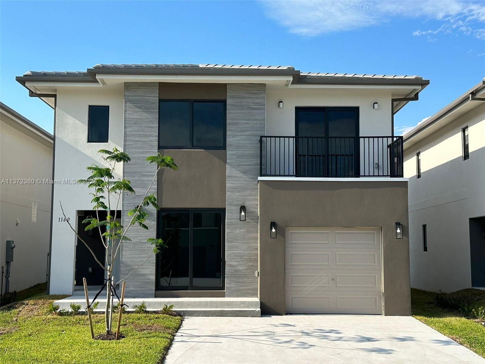 AMAZING NEW CONSTRUCTION, 2 story home, 5 beds 4.5 baths, garage & fenced backyard. Located in a great residential community in Florida City. Beautiful open kitchen with s/s appliance, stone counter top, double sink. Front load full side washer & dryer. Title flooring throughout the house, impact windows. This house offers a full bedroom with closet & bathroom downstairs . Master room with walking closet and double sink in bathroom. Excellent finishes throughout the house. YOU HAVE TO SEE IT!!!!! ONLY 1st MONTH RENTAL AND 1 MONTH SECURITY DEPOSIT!!