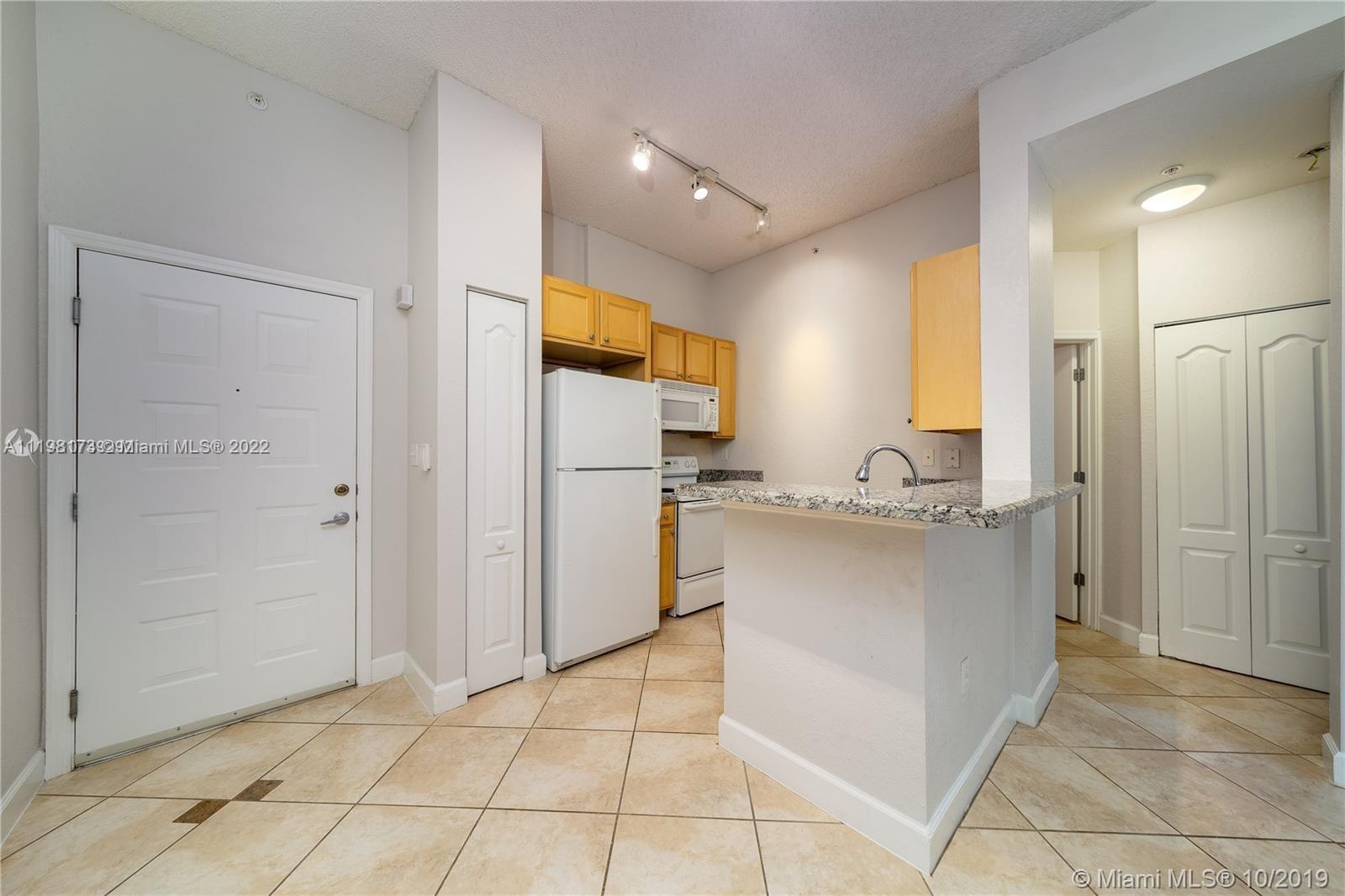 Tenant occupied until May 15th. BRAND NEW SS APPLIANCES (not shown in photos). 1 BR + 1 BA apartment with high ceilings & great natural light with walk-out access from back terrace to common area interior courtyard. The unit is tiled throughout & has updated granite countertops, updated bathroom, in-unit W/D, & blackout shades. Includes 1 assigned parking spot in the garage. Centrally located near UM, Larkin Hospital, Coral Gables, Coconut Grove, and Downtown South Miami with easy access to major highways and public transportation (Metrorail Station and Buses). Great amenities include a pool and fitness center. 24-hour security.