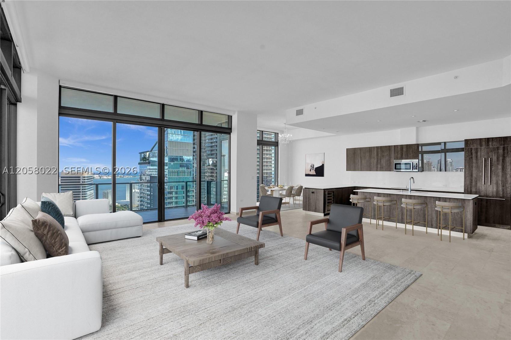 Perched high above the city in one of Brickell's most coveted addresses, this breathtaking corner residence offers 4 bedrooms, 4.5 baths, and dedicated service quarters — a rare combination of scale, privacy, and refinement. Floor-to-ceiling glass frames never-ending views of Biscayne Bay and the Miami skyline, with light pouring in from two exposures throughout the day.

Every detail has been curated for the most discerning buyer: marble flooring, soaring ceilings, and a chef's kitchen outfitted with top-of-the-line appliances and a wine cooler. Custom built-out closets, electric blackout shades, and designer finishes complete a home that lives as beautifully as it shows.

Residents of RISE enjoy a half-acre amenity deck with heated lap and social pools, poolside café service, a state-of-the-art fitness center, a full-service residents' spa with hammam, a library, business center, children's playroom, tropical gardens, on-site concierge, valet, and 24-hour security. Step downstairs to Brickell City Centre's world-class shopping and dining — Saks Fifth Avenue, an Apple store, a cinema, and acclaimed restaurants — with the financial district, Mary Brickell Village, Miami International Airport, and South Beach all just minutes away.