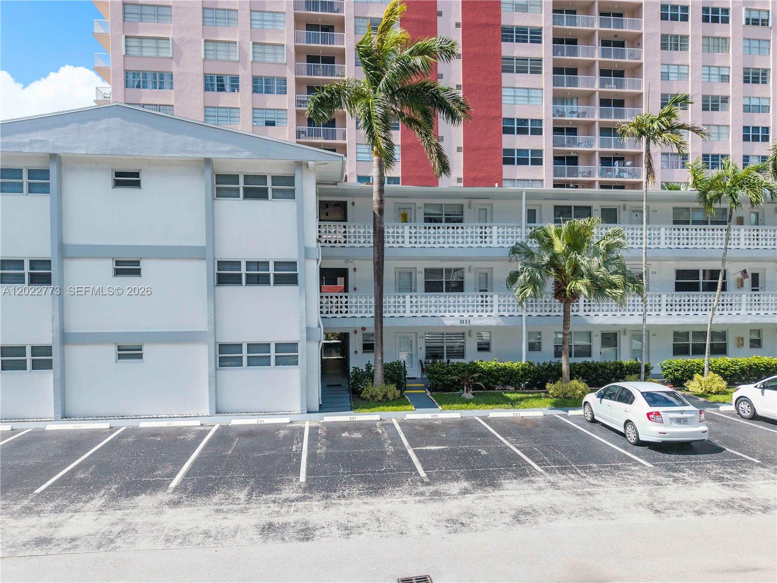 Charming 1-Bedroom, 1-Bathroom Condo In The Sought-After South Ocean Drive Community Of Hallandale Beach On The Intercostal And A Short Walk To The Beach. The Bright And Inviting Living Area Features An Split Layout That Flows Seamlessly Into The Kitchen. The Kitchen Boasts White Cabinetry With Ample Storage, Granite Countertops, A Classic Tile Backsplash With Bold Accent Detail, And Lots Of Natural Light— Perfect For Morning Coffee. The Spacious Primary Suite Serves As A True Retreat, Featuring A Decorative Ceiling Fan/Light Fixture, A Comfortable Sitting Area, And Access To A Beautifully Updated En-Suite Bathroom Complete With Rich Dark Wood Cabinetry, A Quartz Countertop Vanity With Built-In Linen Tower, And A Stunning Walk-In Shower With Floor-To-Ceiling Tile, And A Glass Enclosure. Tile Flooring Flows Throughout The Entire Unit For Easy Maintenance. Enjoy The Convenience Of An On-Site Laundry Facility. Step Outside To Your Own Private Covered Corridor Entrance With Lovely Tropical Views. Perfectly Located Just Minutes From The Beach, Gulfstream Park, Top Dining, Shopping, And Major Highways — This Is South Florida Living At Its Best!