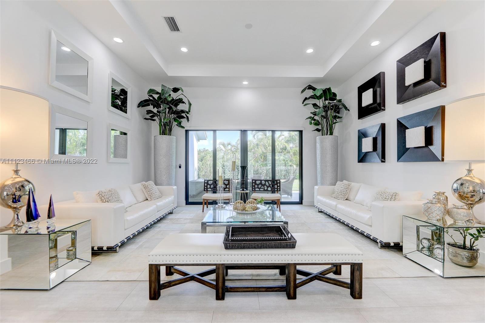 This stunning luxury home is located in a prestigious 24-hour guard-gated community. The property features 5 bedrooms & 4.5 bathrooms, impact windows & doors, Porte-Cochere, and a custom kitchen with top-of-the-line appliances and a large island. The spacious backyard offers two terraces, a pool perfect for Miami, and even more space for entertaining and activities. The home is in an A+ school area and close to world-class restaurants and shopping.