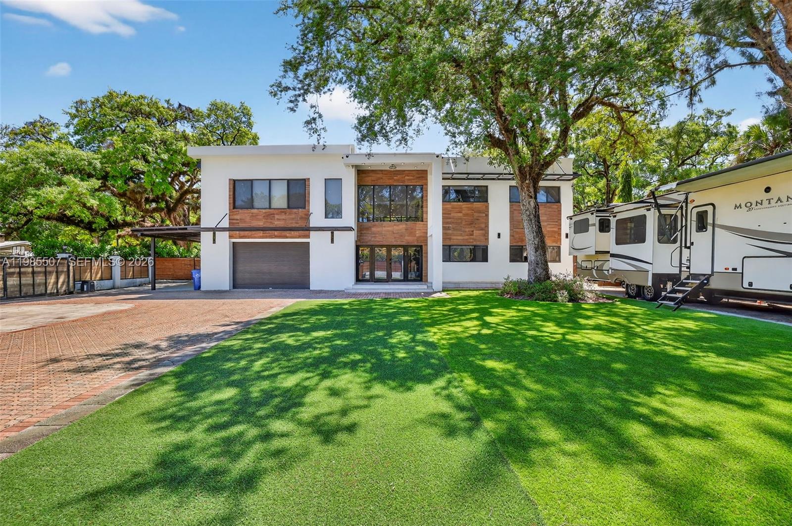 Brand New Custom Built Modern Estate w/ design & style. Built w/ the finest imported materials, 3X6 Porcelain Tile Floors, Floor-Ceiling Windows, 20+ Ft high ceilings, Open Concept, Chef's & Butler's Kitchen, 6 large bedrooms w/ walk in closets & spa-style baths, plus office, plus Loft, could be a 7 bed home, or keep it with all the open spaces. Ground floor has ensuite Bedroom plus 2nd bedroom for your guests, extended family. An oversize elevated 17,915 sq ft lot w/ total privacy in a lush natural setting & 4 gates gives you room for your boats, RVs, jet skis, Basketball, Pickleball court, putting green & more. Extras include a private bunker, smart home tech & electronics room, Summer Kitchen, home theater, upstairs & downstairs laundry, ample parking for 15+ cars.  furnished/unfurnished. Estate now also available for long term or weekly / monthly short term lease, movie production, influencer studio.  Available for immediate same day move in and you can "try before you buy".
