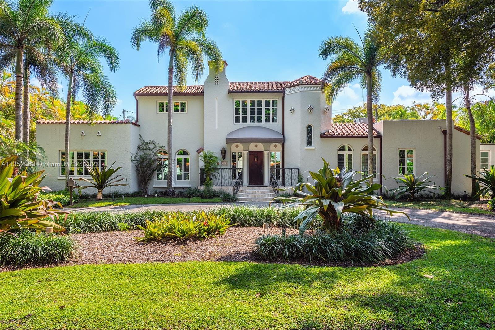Boasting a unique combination of character and history, stunning designer updates, and a highly-coveted location on storied Columbus Blvd, this property is an absolute dream. The modern upgrades throughout the interior perfectly complement the character & charm of the original 1925 architecture, resulting in a flawless blend of old and new. The private primary suite includes an office, sitting room, & luxurious bath, while 5 additional en-suite bedrooms, a dedicated office, & full guest/in-law quarters provide ample space for family & friends. Outside, you'll find a beautiful pool, brick patio, and summer kitchen, perfect for relaxing or entertaining guests. Impact windows & doors, newer roof, and stunning canopy of banyan trees provide the finishing touches on this impressive Gables home.