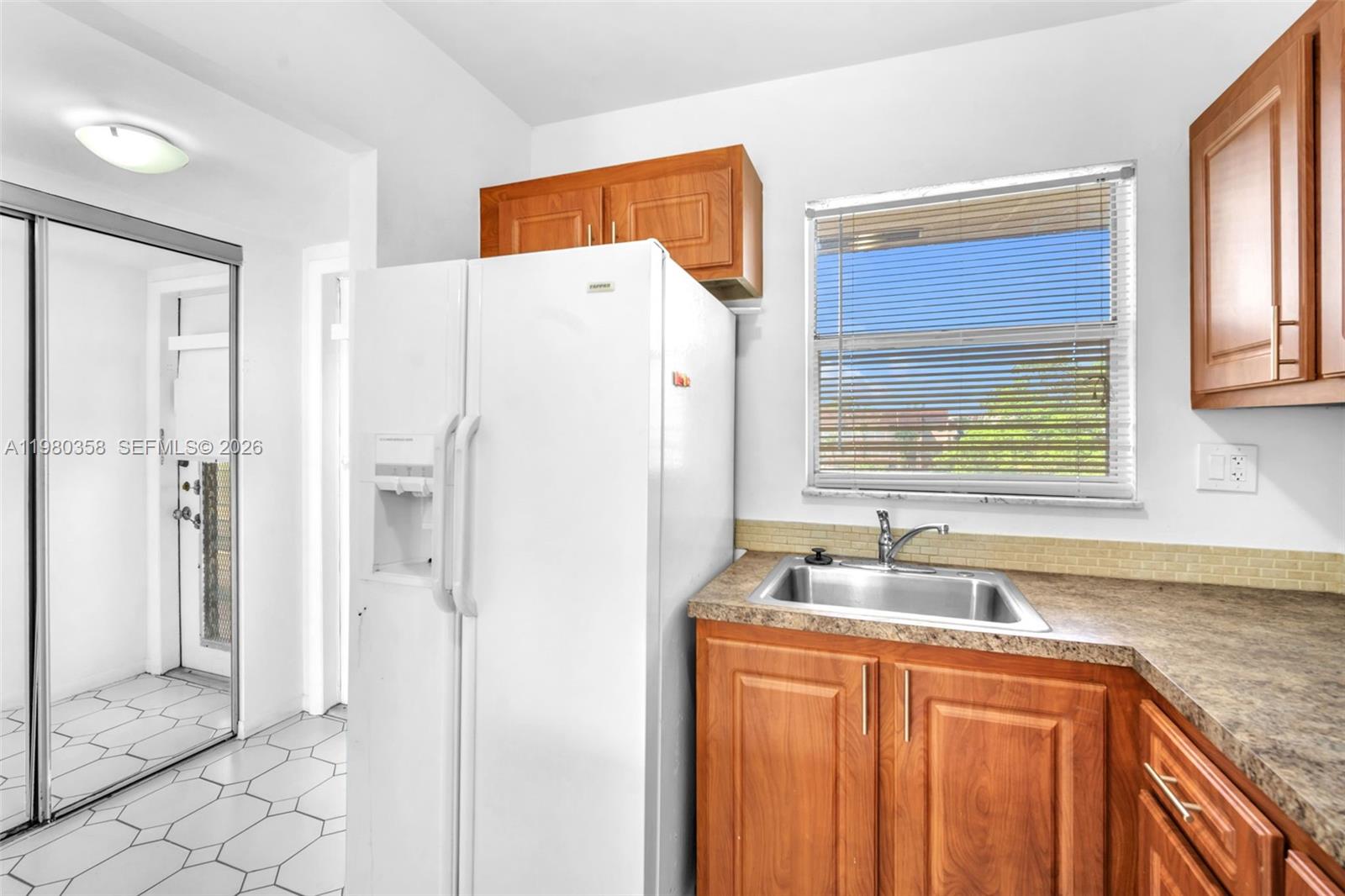 Amazing 1/1 fully remodeled in the most desirable Sunrise Lake Condominium. Beautiful view of the lagoon and super bright. Enclosed balcony for extra space.  Laundry facilities on each floor. Great amenities.   55+.  Won't Last!