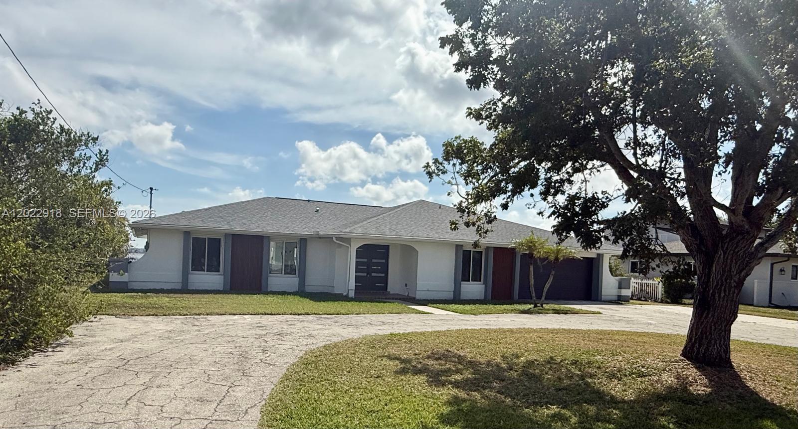 Unique Opportunity in North Fort Myers! Discover this stunning 2,549 sqft home in the exclusive North Shore Avenue neighborhood! This beautiful property boasts 4 bedrooms, 2 of them are master. Plus versatile den or office. Open design that perfectly blends comfort and elegance. Everything is new in this house, kitchen cabinets, top of the line appliances, porcelain floors, all 3 bathrooms are new, all impact windows and doors, recently installed new shingle roof. Beautiful in ground pool and private boat dock on the Caloosahatchee River right on your backyard and open waterway directly to the Gulf of Mexico