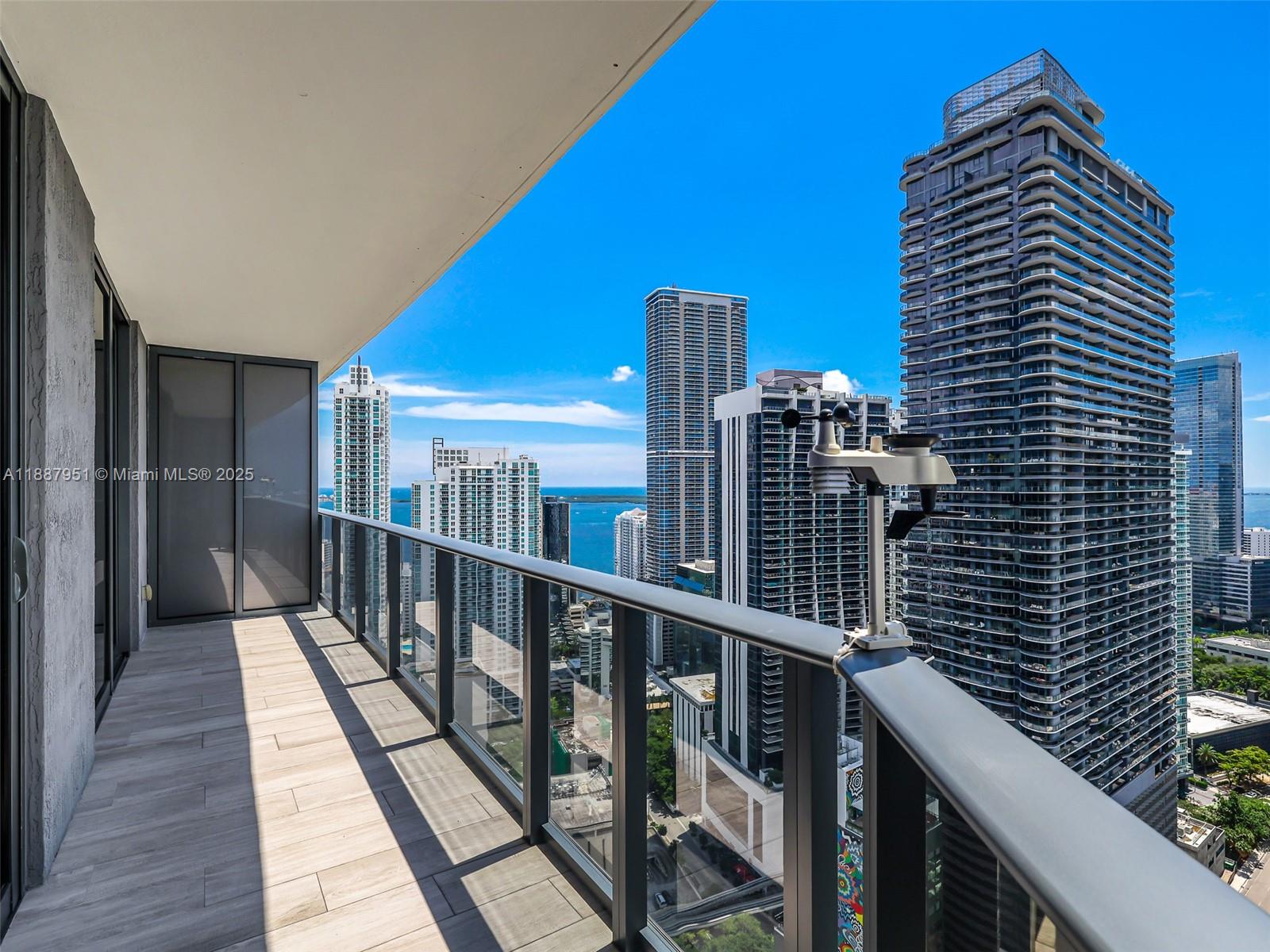 Luxury living at Brickell Heights East! Stunning 1+Den, 2 Bath on the 39th floor offering breathtaking east-facing bay views from a spacious balcony. Modern design features sleek finishes, porcelain floors, and floor-to-ceiling windows, filling the unit with natural light. A European kitchen with high-end Monogram appliances, custom closets, mirrors, and sliding doors adds elegance and functionality. All appliances are like new. Enjoy resort-style amenities: rooftop pool, Equinox fitness center, spa, movie theater, business & conference rooms, kids' room, and 24-hour attended lobby with concierge & valet. Basic cable, water & internet included. Located in the heart of Brickell, steps from Brickell City Center and Mary Brickell Village, with world-class dining, shopping, and entertainment.