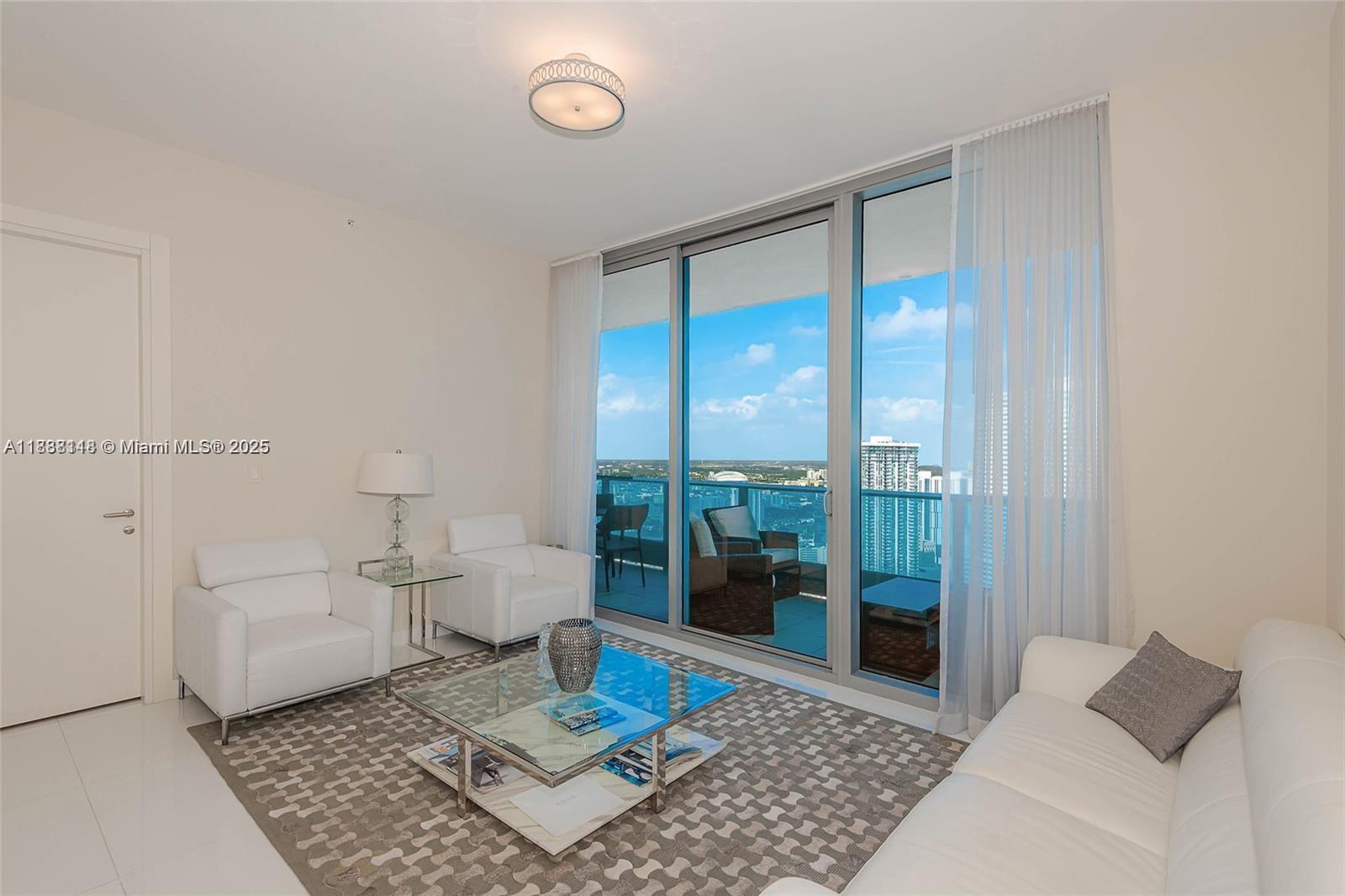 Experience elevated luxury living in this lower-penthouse residence at Epic West, ideally positioned in Miami’s skyline with sweeping water and city views. 2 Bedrooms + Den / 2.5 Bathrooms — thoughtfully configured with generous living spaces
1,237 sq ft of refined interior, professionally furnished and move-in ready.Open-concept layout with floor-to-ceiling windows — light fills every corner and showcases panoramic vistas

Gourmet kitchen fitted with high-end finishes, custom cabinetry, and premium appliances 
Elegant bathrooms, luxe touches, plus a half bath for guests.

Epic West is a full-service, resort-style tower with top-tier amenities: spa, gym, multiple pools, concierge, valet, and access to renowned restaurants on-site.