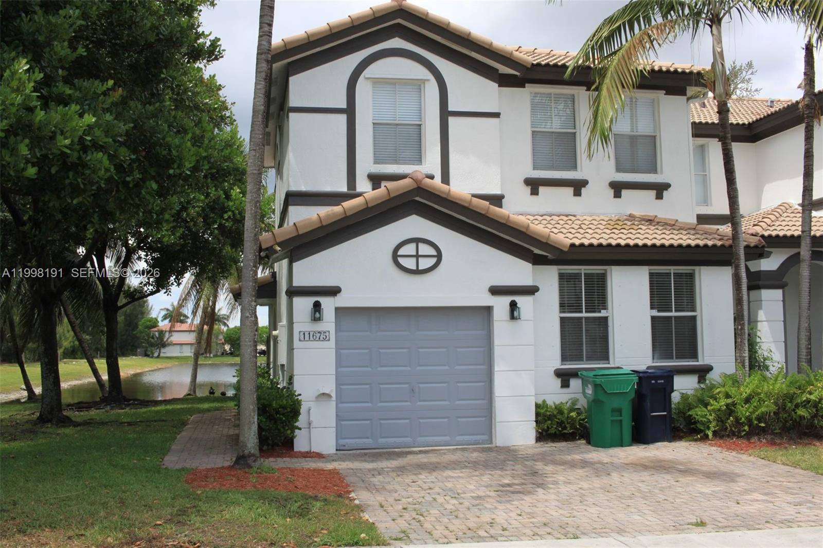 Experience the charm of this beautiful corner-lot townhouse in the exclusive Windward gated community, offering stunning views of the nearby lake. This spacious home boasts three well-appointed bedrooms and two-and-a-half modern bathrooms, making it perfect for families or those seeking extra space. The remodeled kitchen features updated appliances, stylish countertops, and ample storage, ideal for cooking and entertaining. Additionally, residents can enjoy the convenience of being just a short walk away from the community pool, perfect for relaxing on warm afternoons. This townhouse is ideally situated with easy access to the Florida Turnpike, ensuring seamless travel for work or leisure. Plus, it's close to a variety of recreational parks for outdoor activities and a major shopping center for all your retail needs, providing the perfect balance of relaxation and convenience.