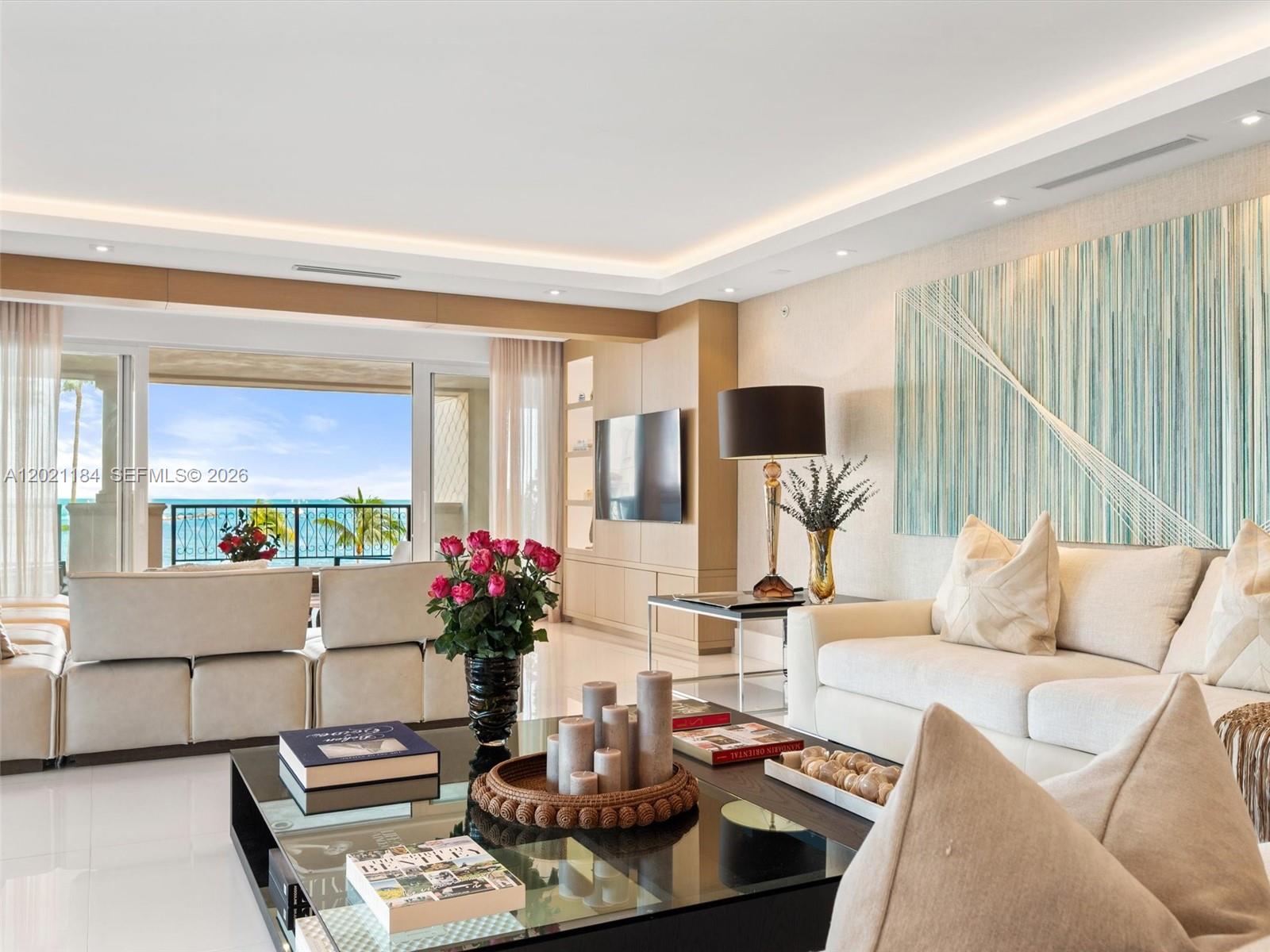 This stunning Oceanside unit on Fisher Island redefines luxury living at its finest. Completely renovated to perfection, it encompasses 4,086 sq. ft. interior, 4 bedrooms, 4.5 baths, wrap-around terraces overlooking the ocean and government cut. Professionally designed, state-of-the-art kitchen, marmoglass and wood floors throughout, impact glass doors, and more features. Live the Fisher Island lifestyle in this exceptional unit!