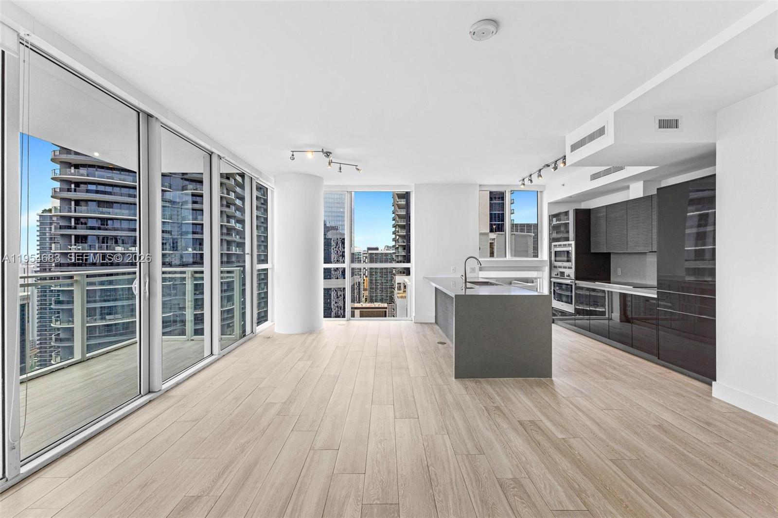 Experience sweeping city views and spectacular sunsets from this high-floor corner residence at The Bond at Brickell. This spacious, light-filled 2-bedroom, 2-bath home offers 1,134 SF of interior living space and features a massive balcony extending from the living room to the primary suite, perfect for indoor-outdoor living and entertaining. Interiors showcase wood-look porcelain floors throughout, a modern kitchen with Bosch appliances and quartz countertops, custom closet built-ins, and blackout and sun shades in every room. Recent updates include a new shower enclosure in the second bathroom, updated bathroom lighting, fresh interior paint, and a recently serviced A/C unit. Centrally located in Brickell’s Financial District, The Bond is steps from Mary Brickell Village, Brickell City Centre, premier dining, entertainment, and offers full five-star amenities for resort-style living. Flexible rental policy. Can rent min 30 days 12 times a year.