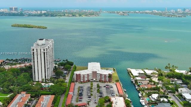 Spacious and bright 2 bedroom 2-bath Bayfront condo with a well-designed and funcional floor plan filled with natural light. comfortable living and dining areas, elegant wood flooring throughout, and 2 assigned parking spaces. Enjoy beautiful water views from both the living room and primary bedroom, creating a serene waterfront living experience. located in the desirable Miami Shores area, close to shopping, dining, and major highways. Excellent opportunity for buyers seeking a well-located bayfront residence in Miami Shores.