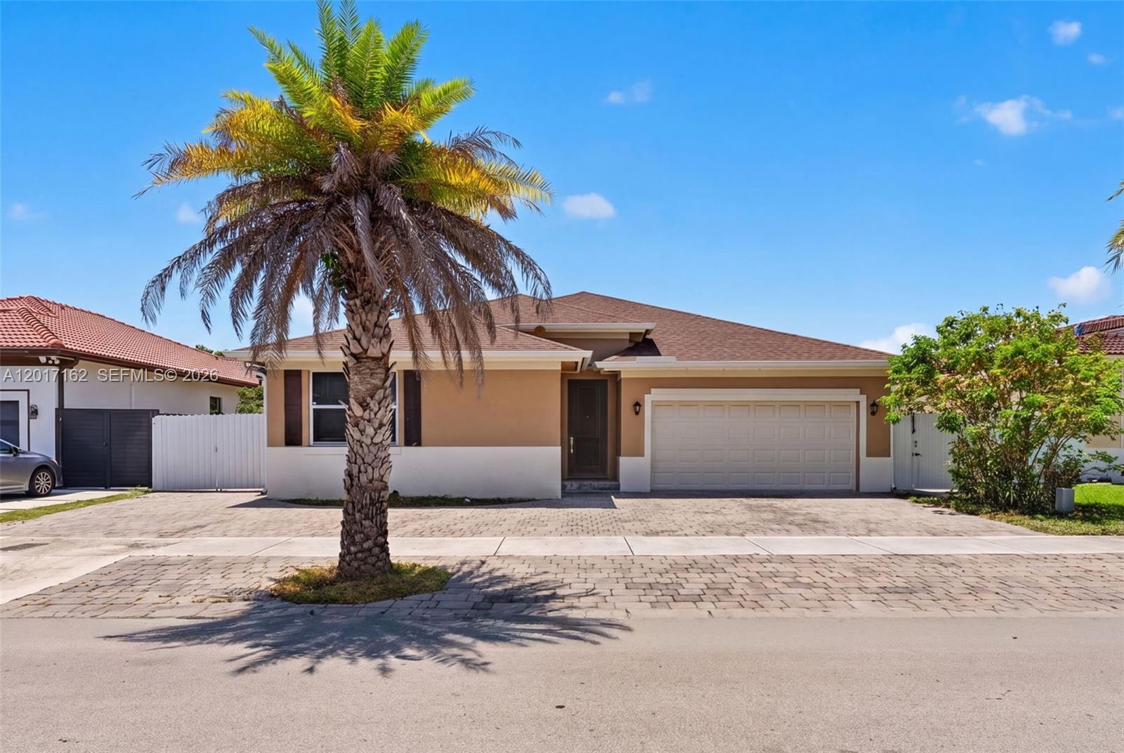 Imagine the ultimate blend of luxury, convenience, and opportunity in this beautifully designed 4 bedroom, 3 bath home built in 2018. Centrally located in Homestead with quick access to major expressways, shopping, dining, schools, parks, and daily conveniences, this move-in-ready property offers the flexibility today’s buyers are looking for. The main residence features 3 spacious bedrooms and 2 bathrooms, while a private 1-bedroom, 1-bath in-law suite offers the option to connect to the home or remain independent with its own entrance leading to a gated patio, making it ideal for guests, multigenerational living, a home office, or potential rental income. Enjoy resort-style outdoor living with a custom pool, stunning waterfall feature, travertine deck, and a thoughtfully designed pergola perfect for entertaining and relaxing. Additional highlights include a double car garage, a shed, and a custom covered vinyl carport providing secure, protected parking for boats, RVs, jet skis, and recreational vehicles. No HOA, no association, and no deed restrictions. Located just 15 minutes from Homestead Bayfront Park. Schedule your private tour today!