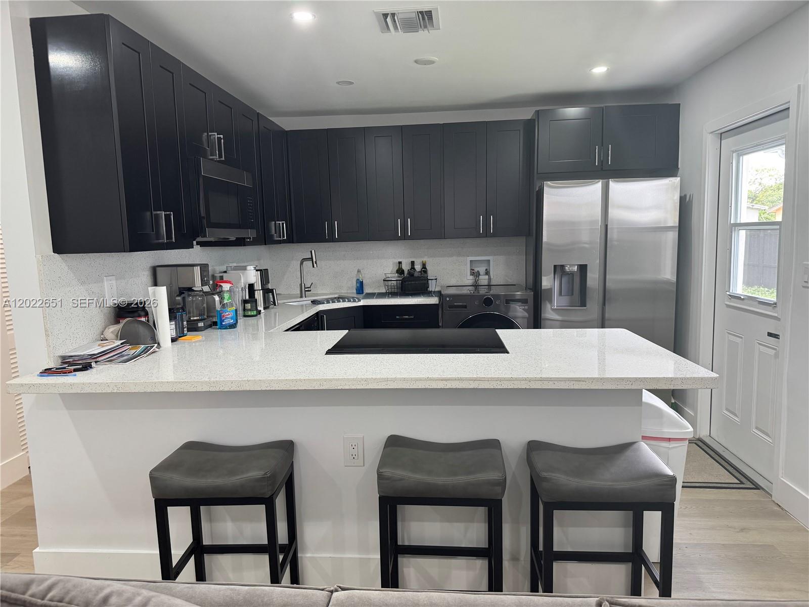 PRICED TO SELL! ALL AGES! Completely remodeled and move-in ready in the heart of Pompano Beach! This beautiful home has been fully upgraded with a NEW roof, NEW electrical system, Impact windows and doors provide both style and peace of mind. The open stunning open -concept kitchen with quartz countertops  is designed for effortless everyday living and entertaining.  New A/C, modern vinyl flooring  and stylish finishes throughout, shaker cabinets, and stainless steel appliances. Spacious double  fenced yard with plenty of room for a pool, boat, or RV. NO HOA! Perfect for first-time buyers, Airbnb investors, or anyone looking for a turnkey property with zero updates needed. Conveniently located near major highways, shopping, dining, and just minutes from the beach. This one will not last — schedule your showing today! Furniture negotiable!