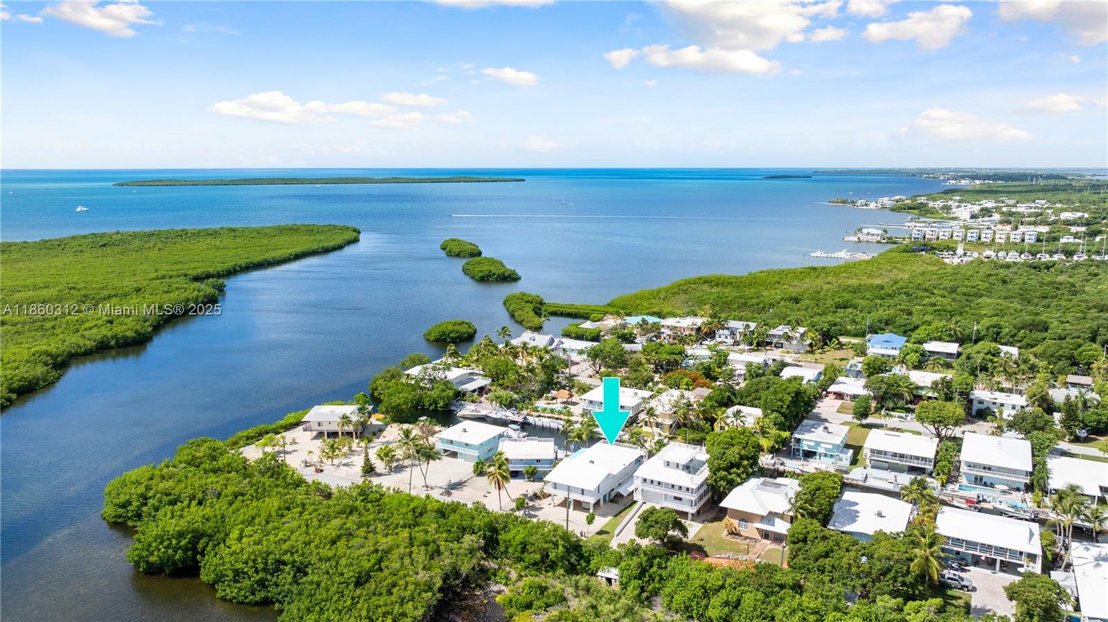 Waterfront Key Largo Retreat
This is an exceptional all-CBS-constructed home, featuring a concrete roof that enhances durability and peace of mind, offering direct ocean access and putting world-class fishing and diving right at your doorstep, all while being ideally located for an easy mainland commute.
This spacious two-story home offers over 3,100 square feet of living space. The top floor features an open-concept design that seamlessly combines the living, dining, and kitchen areas—ideal for entertaining family and friends. A guest bedroom, guest bathroom, and an office/multi-purpose room with a full bathroom, along with a stunning master suite with a spacious bedroom and spa-like bath, provide versatile living options.
The permitted first-floor addition was added in 2001 and features 2 bedrooms, 1.5 baths, and a garage. 
Enjoy a 60-foot split-level concrete dock with step-down access perfect for kayaks, paddle boards, and low-profile vessels, plus ample parking space for boats, RVs, and trailers to support your outdoor adventures
Whether it's a sunrise paddle, an afternoon fishing trip, or an evening cruise, this property is your launch point for all your Florida Keys adventures. Envision living the waterfront lifestyle you've always dreamed of.
