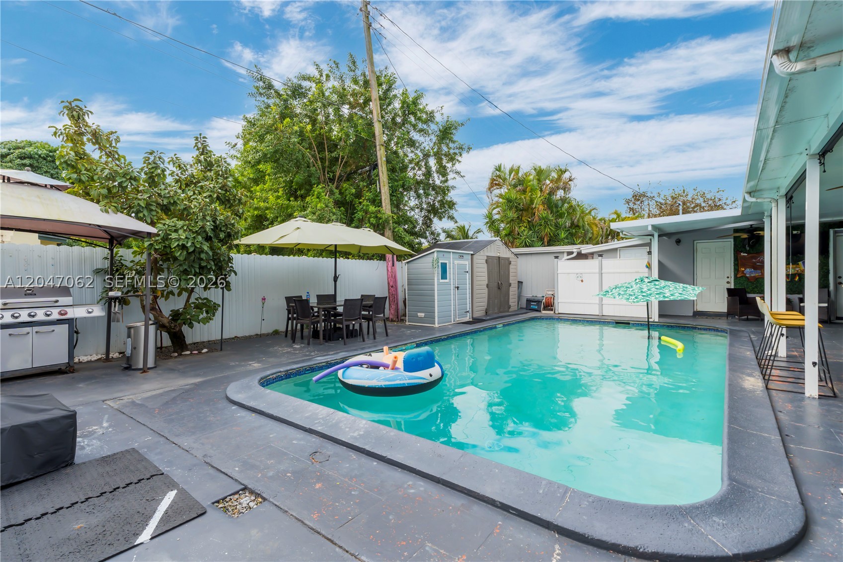 Welcome to this inviting 5-bedroom, 4-bath single-family home nestled in the heart of Miramar! This charming one-story residence sits on a generously sized lot and features a sparkling below-ground pool, perfect for relaxing, entertaining, or enjoying Florida’s year-round sunshine.

Step outside to your private fenced backyard oasis complete with a patio, awnings, hurricane shutters, and plenty of room for gatherings and outdoor enjoyment. A covered carport and driveway provide ample parking.

Conveniently located near schools, parks, shopping, dining, and major highways, this home offers comfort, flexibility, and excellent accessibility. With no HOA and no rental restrictions, it’s ideal for homeowners and investors alike. Whether you’re a first-time buyer, downsizing, or seeking a solid investment opportunity, this property is full of potential. Schedule your private showing today!