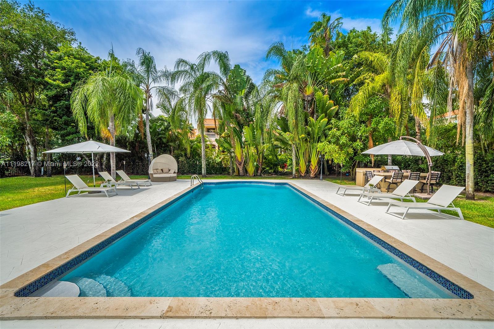 Contemporary 5 bedroom, 4/1 bath home in the exclusive Islands of Cocoplum. Expansive living areas overlooking the pool and outdoor terrace. Beautiful, large kitchen opens to the family room as well as formal dining room.  Primary suite features a private balcony, 2 large closets, oversize bathroom with double shower, 2 vanities and free – standing tub. Two additional en-suite bedroom and family room complete the upstairs. Gorgeous pool area with covered terrac, expansive space for entertaining and 2 full cabana baths. Impact resistant doors, elevator, electrical, plumbing, A/Cs and roof updated in 2017.