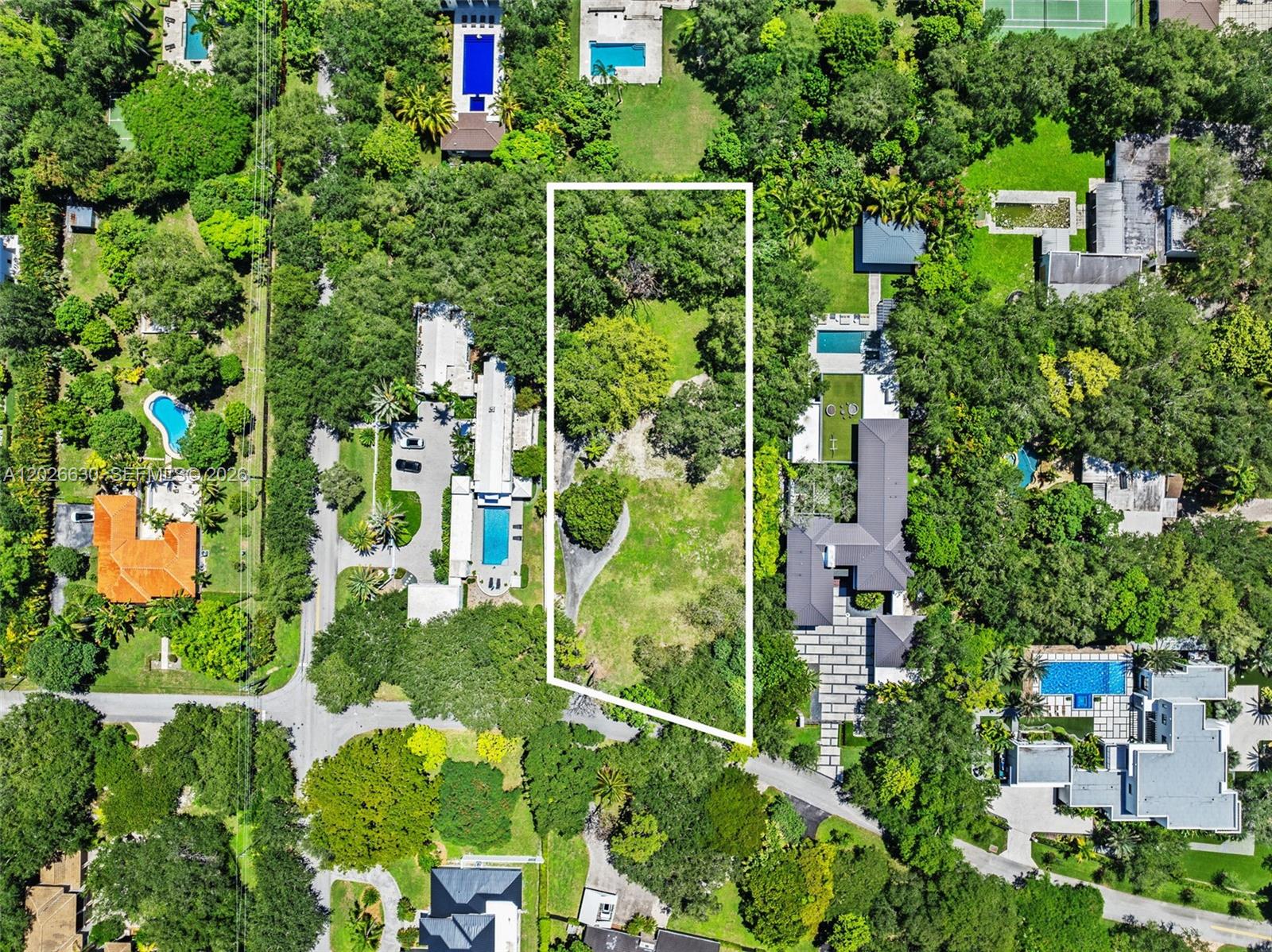 Rare opportunity to build your dream estate on an expansive 40,469 sq ft residential lot in the heart of highly desirable Pinecrest. This exceptional property offers the ideal setting to create a custom luxury residence surrounded by mature trees, beautiful estate homes, and the peaceful residential atmosphere.