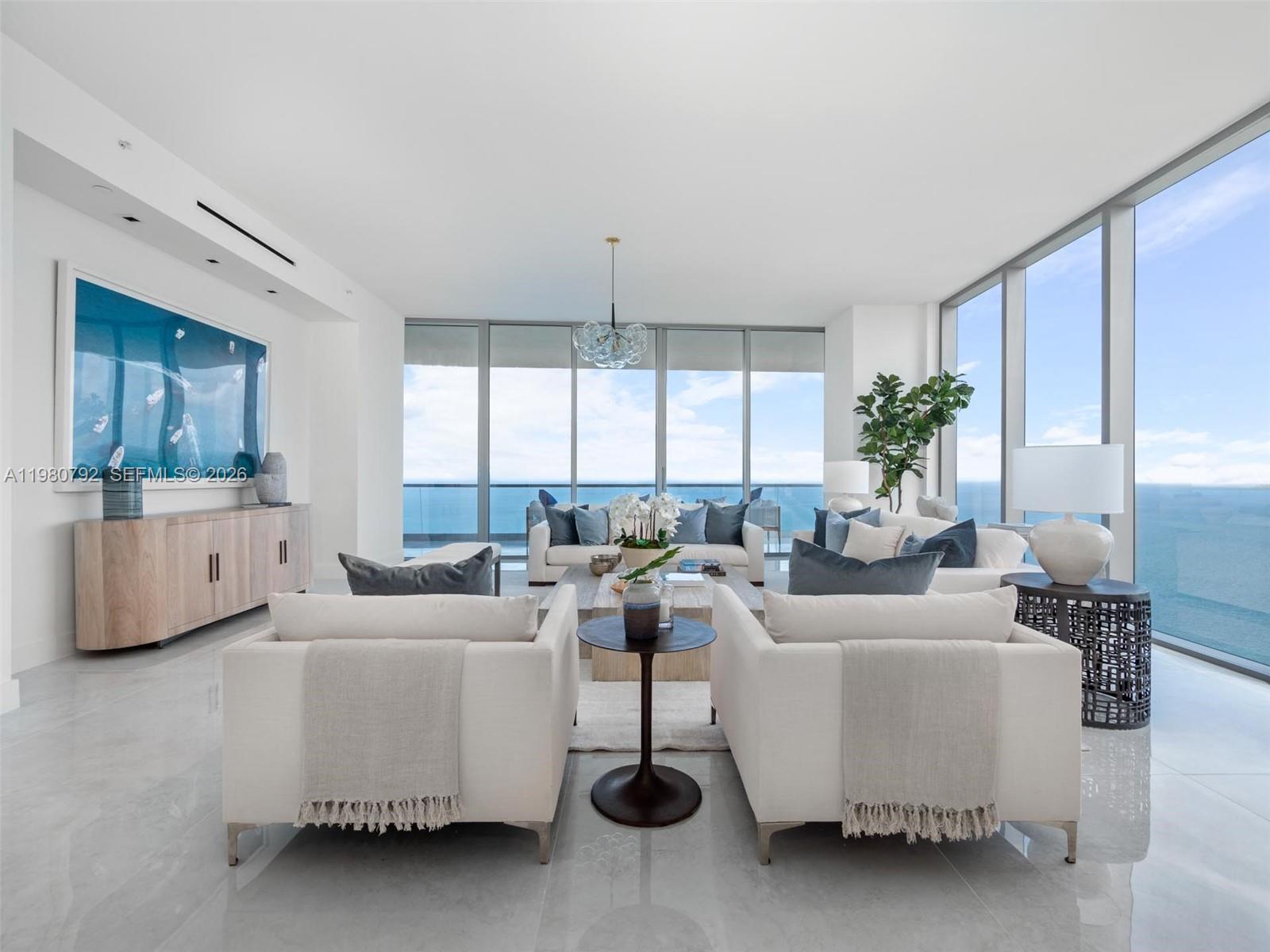 Experience unparalleled luxury from the 43rd floor of the prestigious Turnberry Ocean Club Residences. This residence features an exceptional floor plan featuring 4 bedrooms plus a spacious den with breathtaking ocean and city views. This gem is further complimented by soaring 11-foot ceilings and an upgraded white Snaidero kitchen, equipped with top-of-the-line Wolf and Sub-Zero appliances. Designed for the most discerning buyers, the residence blends modern elegance with world-class craftsmanship. Turnberry Ocean Club offers an unmatched lifestyle with 6 levels of extraordinary amenities, including the exclusive Sky Club, private theater, three resort-style swimming pools, poolside bar, restaurant, and full-service beachfront offerings. A rare opportunity to enjoy elevated oceanfront living in one of South Florida’s most iconic luxury towers.