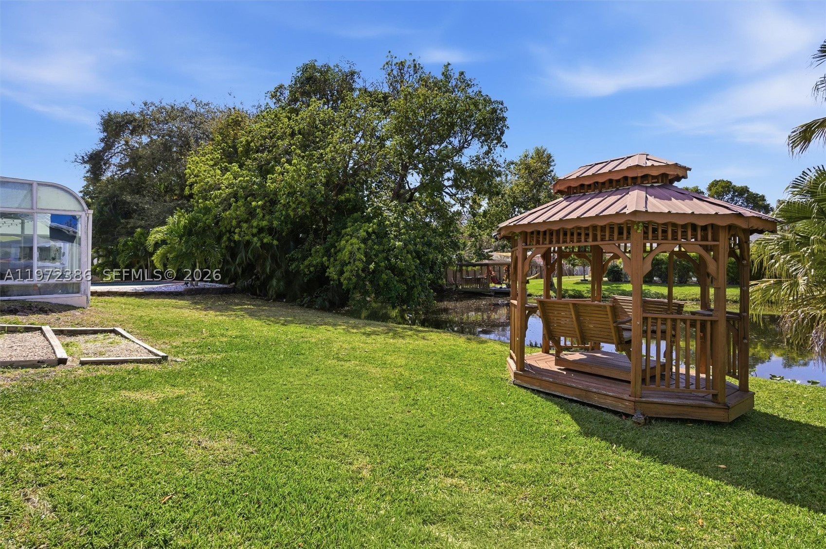 Stunning 4-bedroom, 3-bath residence showcases expansive living.The private backyard oasis is truly exceptional—featuring a resort-style pool, two strategically placed gazebos and tranquil pond views that create a serene and exclusive atmosphere.
Ideally located on Plantation acres close to the Equestrian Center, and just minutes from Sawgrass Mills Mall, with convenient access to major highways, fine dining, and premier shopping destinations.
An extraordinary opportunity to own a distinctive property in one of Plantation’s most coveted neighborhoods, where space, elegance, and location converge seamlessly.