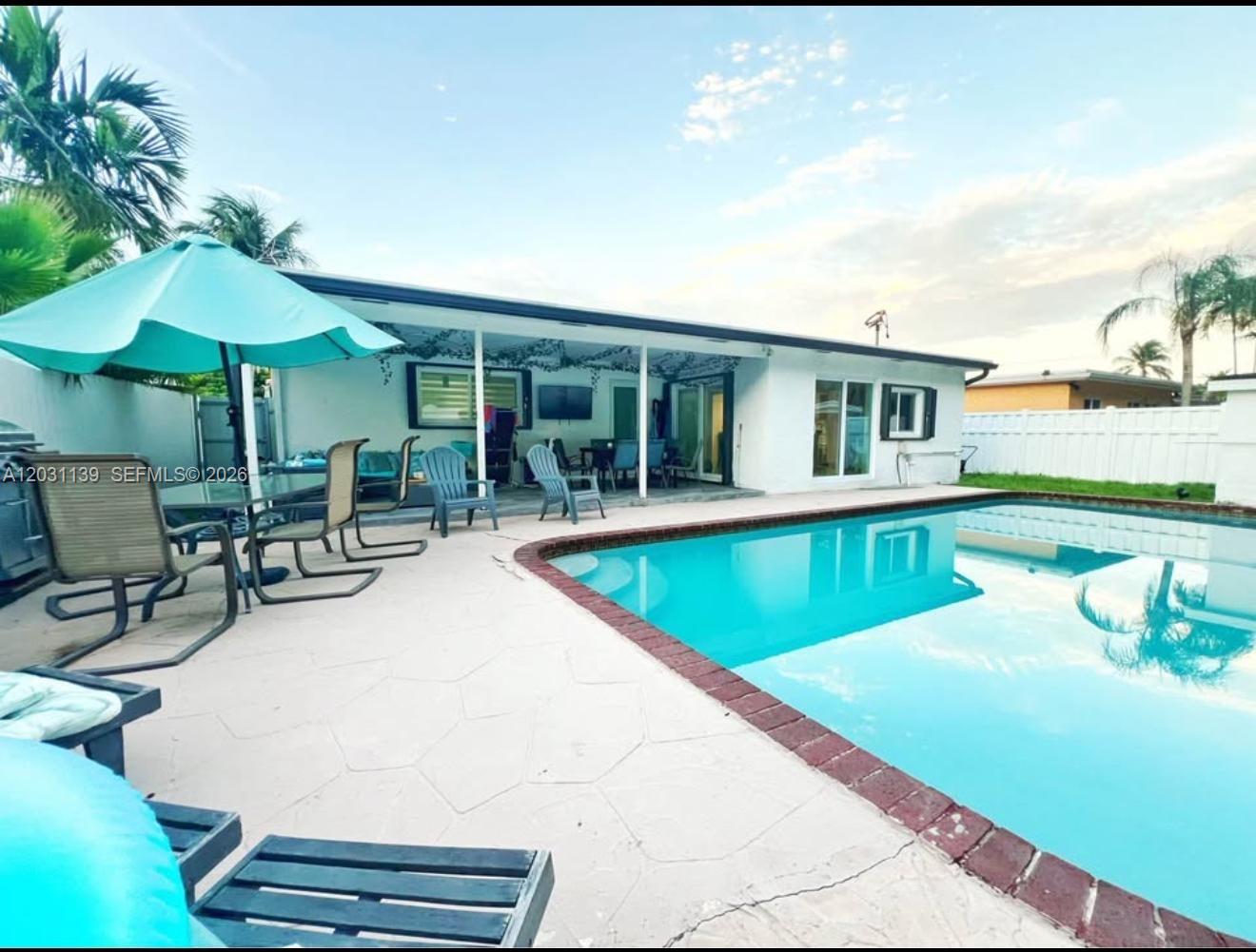 Beautiful 3-bedroom, 2-bathroom home with a big pool and a large patio in Sunrise. Completely renovated, 2023  ROOF, Impact Doors and Windows, new kitchen, appliances, new Floors, new Diamond Brite Pool Resurfacing and new bathrooms. Located just 5 minutes from Sawgrass Mills, close to restaurants and schools; a home in the best area of Sunrise.