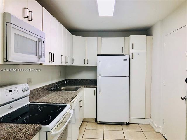 Top floor unit 2/2, in very good shape, condo in North Miami Beach offers 1,023 sqft of living space with fantastic amenities, including a pool, gym, on-site management, and night security patrols. Located in a prime area. investor friendly, unit is rented $2,190 monthly, unit is under 50 years certification, special assessment $254.20 starting on August 2025 for 120 months payable by buyer. Unit is sold with unit #235, #305, #408, #435, #402, all located at 1800 sans souci blvd.