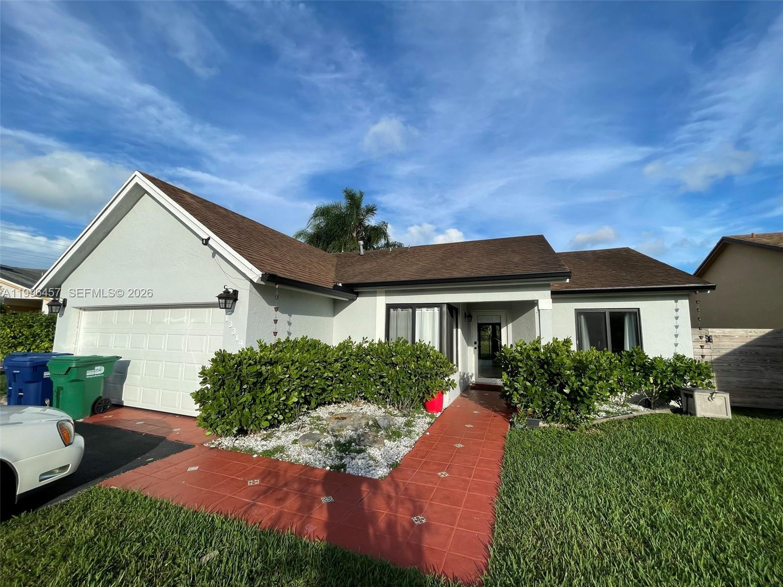 This beautifully updated 3-bedroom, 2-bath home offers a serene lifestyle in a gated community. The renovated kitchen boasts modern finishes, perfect for cooking and entertaining, while the primary bathroom features stylish upgrades. Enjoy peaceful canal views from your backyard and take advantage of community amenities, including a pool and recreational areas. Updates include kitchen appliances, a tankless water heater, hurricane impact windows and sliding door, and HVAC system installed in 2021. Conveniently located near the Turnpike, this home combines comfort, style, and easy access to everything you need. Don’t miss this quiet, family-friendly haven!