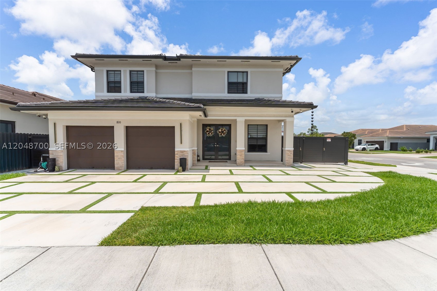Welcome to this stunning almost-new, two-story modern home offering 4 spacious bedrooms, 4 full bathrooms & office garage, corner lot with room to park a boat or vehicle. Designed with both style and functionality in mind to fit any family, including a Jr Suite and a full bathroom downstairs. This modern smart home is move-in ready and features elegant tile flooring throughout the main living areas, with durable laminate flooring on the staircase and bedrooms for a warm contemporary touch. The open-concept layout is perfect for entertaining, while the beautifully designed backyard spectacular private pool with a spa, creating the ideal space to relax and enjoy Florida living. Conveniently located near major expressways, easy access to shopping, dining, schools. This exceptional property is the perfect blend of comfort, convenience, and luxury.