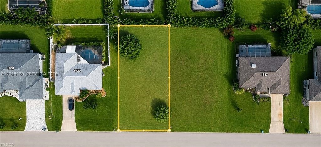 Welcome to one of Southwest Cape Coral's most desirable neighborhoods! This exceptional homesite at **1825 SW 47th Ter** offers the perfect opportunity to build your dream home in a well-established area known for its beautiful surroundings, upscale homes, and unbeatable location. Even better, **all city water and sewer assessments are paid in full**, saving you thousands in future costs. Enjoy the best of the Southwest Florida lifestyle with easy access to Cape Harbour, Tarpon Point Marina, waterfront dining, boutique shopping, parks, boat ramps, and some of the area's most beautiful Gulf beaches. Whether you're planning your forever home, a seasonal retreat, or an investment property, this prime location offers outstanding value and lasting appeal. Don't miss your chance to own a piece of paradise in one of Cape Coral's premier neighborhoods—where convenience, lifestyle, and location come together.