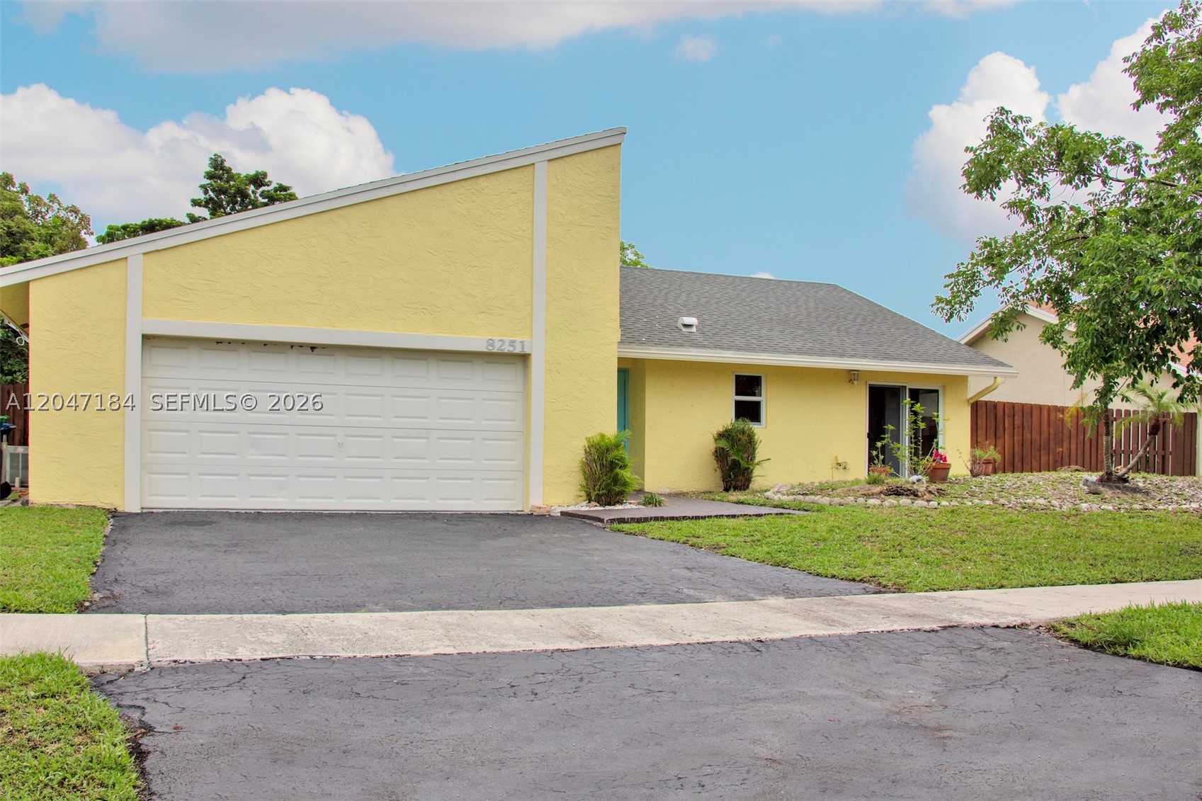 Priced to SELL and NO HOA! Beautiful 3-bed, 2-bath Lauderhill home featuring impact windows and doors, a 2017 roof, and a bright open layout with high ceilings. The updated kitchen offers granite countertops, stainless steel appliances, and ample cabinet space. The living areas include large windows, crown molding, recessed LED lighting, and wood-plank tile flooring throughout the main living areas and bedrooms. Additional features include a 2-car garage, screened-in patio, and a spacious backyard with fruit trees. This is a great opportunity you do not want to miss!