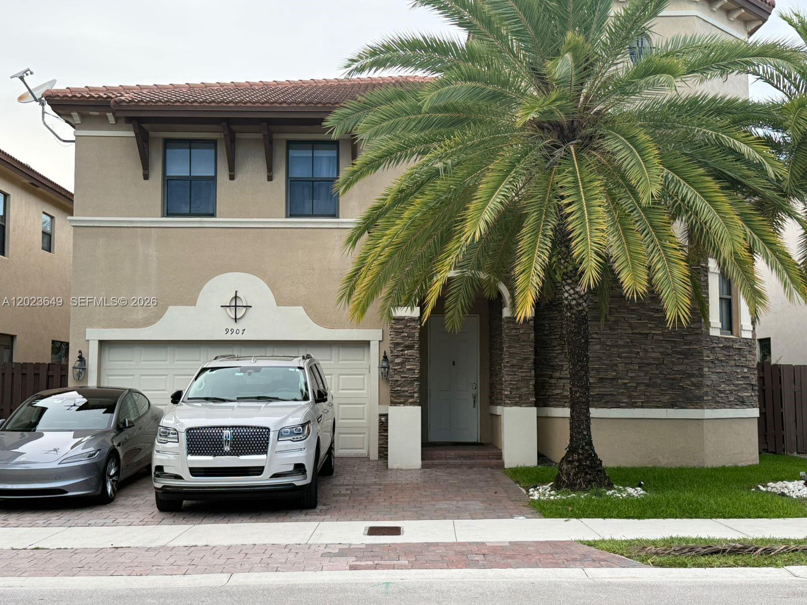 Exceptional 2 story lakefront residence located in the prestigious Grand Bay community in Doral, featuring 5 bedrooms, 5 bathrooms, and approximately 4,159 Sq.Ft. of living area on a 5,000 Sq.Ft. lot. This is one of the largest models within the community, offering expansive interior spaces ideal for both entertaining and comfortable family living. The home features elegant wood flooring installed just 2 years ago, adding warmth and sophistication throughout. Enjoy beautiful direct lake views from the backyard with a BBQ area and mature coconut trees that create a private tropical atmosphere. All bedrooms are generously sized, perfect for family and guests. Laundry appliances are also included. Furniture inside the home may be included depending on the buyer’s preference. This residence offers the convenience of 2 separate A/C units. Located in a highly gated community with an HOA fee of approximately $437 monthly, residents enjoy access to the clubhouse, fitness center, beautifully maintained common areas, paved roads, sidewalks, and a children’s playground conveniently located directly in front of the property, perfect for families and pet owners alike. The home also features a durable tile roof and no rental restrictions, allowing immediate leasing after purchase. Property is not subject to appraisal contingency. Listing agent is also the owner of the property.
