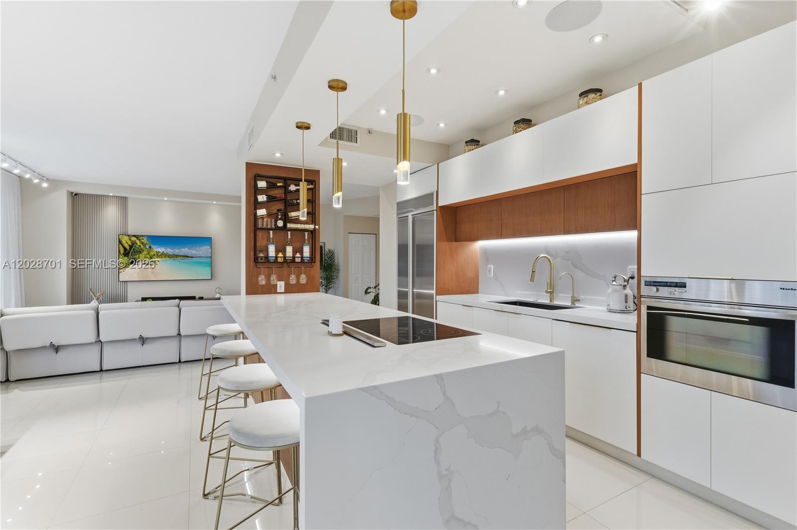 Rarely available first-floor corner residence in the heart of Mystic Pointe with direct marina and open water views. Offering exceptional privacy with no shared walls, this fully renovated waterfront home features one of the most desirable layouts in the community and a seamless indoor-outdoor living experience.

Enjoy your own private waterfront patio overlooking the marina perfect for morning coffee, entertaining guests, or relaxing while taking in the water views. Interior features include a beautifully updated open layout, built-in ceiling speakers in the kitchen and primary bathroom, patio speakers, drinking water filtration system, remote-controlled window treatments, and blackout shades in all bedrooms.

Additional upgrades include a new A/C (2023) and new water heater (2025). Two storage units are included with a full-price offer. Furniture may also be included with full-price offer, excluding baby crib.

A truly turnkey waterfront corner residence combining privacy, views, upgrades, and outdoor living in one of Mystic Pointe’s most sought-after locations. *Rare opportunities like this don’t come to market often*