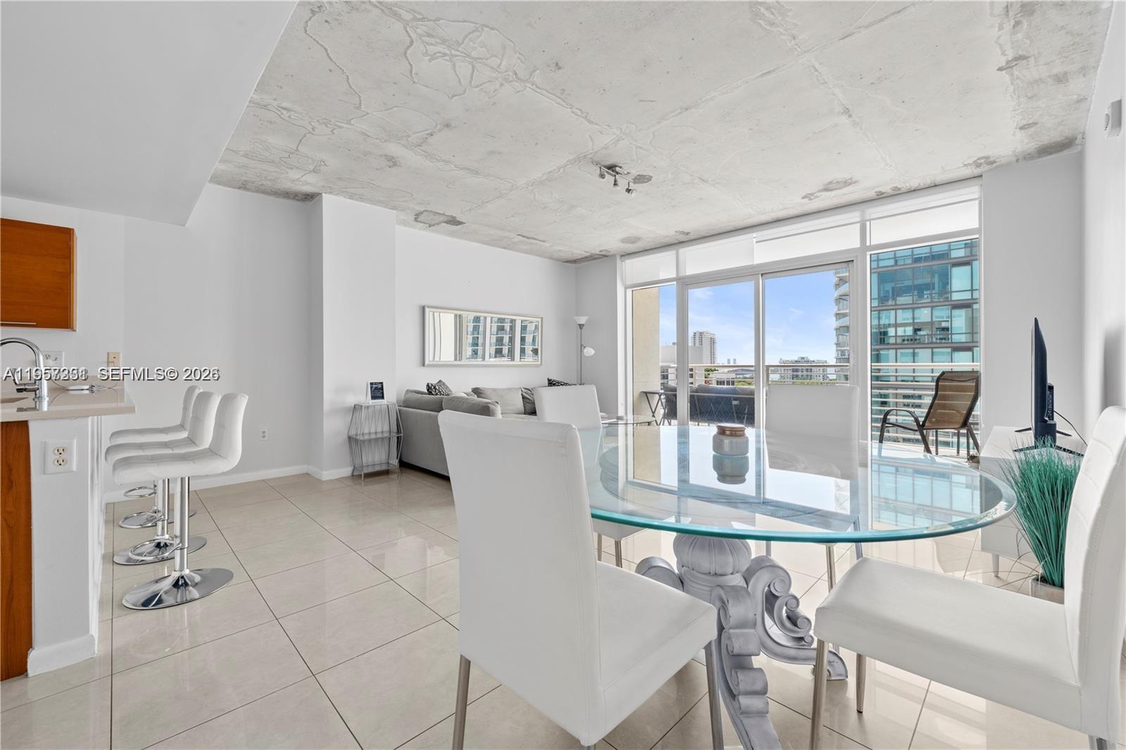 Short term Rental friendly. Spacious 2 bed/2 bath in the heart of Miami's lovely Midtown neighborhood. Faces east and plenty of natural sunlight on 9th of 11 total floors at Midblock. Partial water views from the balcony, ample space & closet space, an equipped kitchen with stainless steel appliances, a washer & dryer, and 1 assigned parking space. Pet-friendly with amenities that include a poolside cabanas, gym, BBQ area, putting green,outdoor ping pong table and 24-hour concierge. Midtown's vibrant restaurant scene, shopping, boutique gyms, and Trader Joe's are at your doorstep. Perfectly located between Wynwood and the Design District.