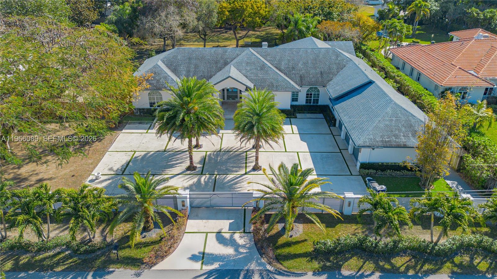 Experience the epitome of modern luxury in the prestigious Miller Drive Estates with this impeccably updated smart home, situated on a rare and expansive 1.13-acre lot. Every detail of this residence has been curated for high-end living, beginning with a striking, one-of-a-kind glass front door and a tranquil front fountain that set a sophisticated tone. The interior is a showstopper, boasting soaring high ceilings, sleek recessed lighting, and breathtaking Calacatta floors that flow seamlessly throughout. At the heart of the home, the gourmet kitchen and updated bathrooms feature premium quartz countertops and contemporary finishes that reflect the latest in designer trends. The exterior of the property is a true masterpiece and an entertainer’s dream. Beyond the security of the gated entrance and the expansive driveway, the massive backyard oasis features a shimmering pool, all set against the backdrop of your own private, sprawling acreage. This unique combination of advanced smart technology, high-end Calacatta and quartz finishes, and unparalleled land size makes this property a standout gem in one of the area’s most sought-after communities.