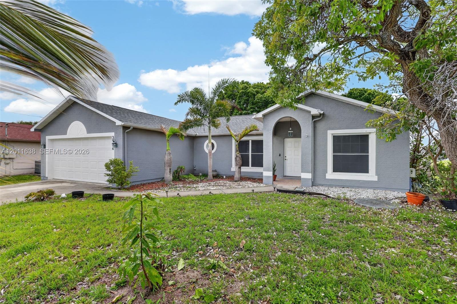 3936 SW Jarmer Rd, Port St. Lucie, FL 34953 Well-maintained single-family home featuring 3 bedrooms and 2 bathrooms, situated on a spacious lot in a quiet residential area of Port St. Lucie. This property offers approximately 1,500 sqft of living space with a functional layout, ceramic tile flooring, and comfortable living and dining areas. The home includes a well-appointed kitchen and a primary suite with a walk-in closet. Recent updates provide added value and peace of mind, including a new roof (2026) and A/C system (2015). Enjoy outdoor living with a private screened-in pool, perfect for year-round use and entertaining, along with a generous backyard space. Additional features include a 2-car garage and ample driveway parking. Conveniently located near major roadways, shopping, dining, and everyday conveniences. Ideal for primary residence or investment opportunity.