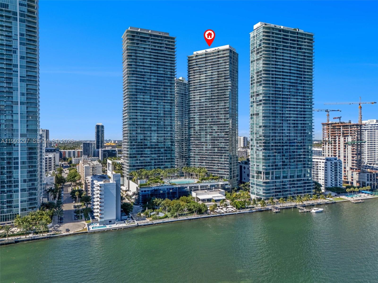 Spectacular unit at the Iconic Paraiso Bay Condo! Stunning direct bay & skyline views. 2 beds, 3 baths + den, private elevator, 9-foot ceiling heights, floor-to-ceiling sliding glass doors, oversized balcony, custom made window treatments & closets, porcelain floors, Italkraft kitchen, sub-zero & Bosch appliances, among others. Top amenities: 100 linear feet pool, Wine cellar & tasting salon, Cigar lounge with private humidors, Kid’s game room with multimedia facilities, Gorgeous party room, Movie theater with state of the art audio visual equipment, Tennis center with 2 lighted tennis courts, Outdoor grill, bay front park with marina and water sports, AMARA Restaurant by Beard Award winning Chef Michael Swchartz, & landscape design by Enzo Enea.