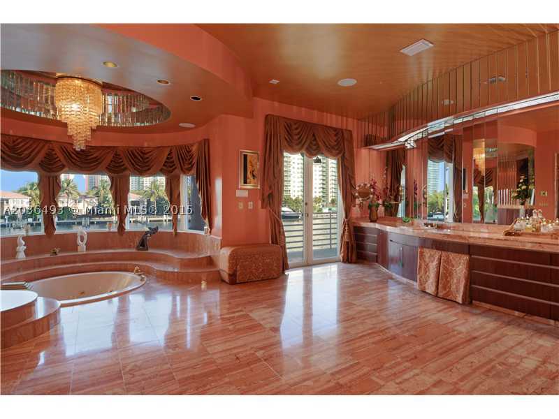 LUXURY & ELEGANCE DESCRIBE THE ONLY AVENTURA WATERFRONT 10,000 SQFT MANSION ON 4 LOTS. 160 FT WATERFRONTAGE W/ APPROVED PLANS TO BUILD A T-SHAPED 110 FT DOCK! FINEST ARTISANS + CRAFTSMEN CREATED A WORK OF ART W/ MILLIONS SPENT IN RECENT RENOVATIONS. WIDE  INTRACOASTAL VIEWS IN EVERY RM. ITALIAN IMPORTED MARBLE + ONYX, OVERSIZED EAT-IN KITCHEN, A MASTERSUITE YOU CAN ONLY DREAM OF W/ 2 ROOM SIZED CLOSETS AND MORE! GYM, HUGE BATH./SPA, SOUND SYSTEM, ELECTRIC SHUTTERS, 4 MORE ENSUITES + GRT RM. A SIGHT TO SEE. SHORT SALE - COMMISSION SUBJECT ON THE BANK APPROVAL
