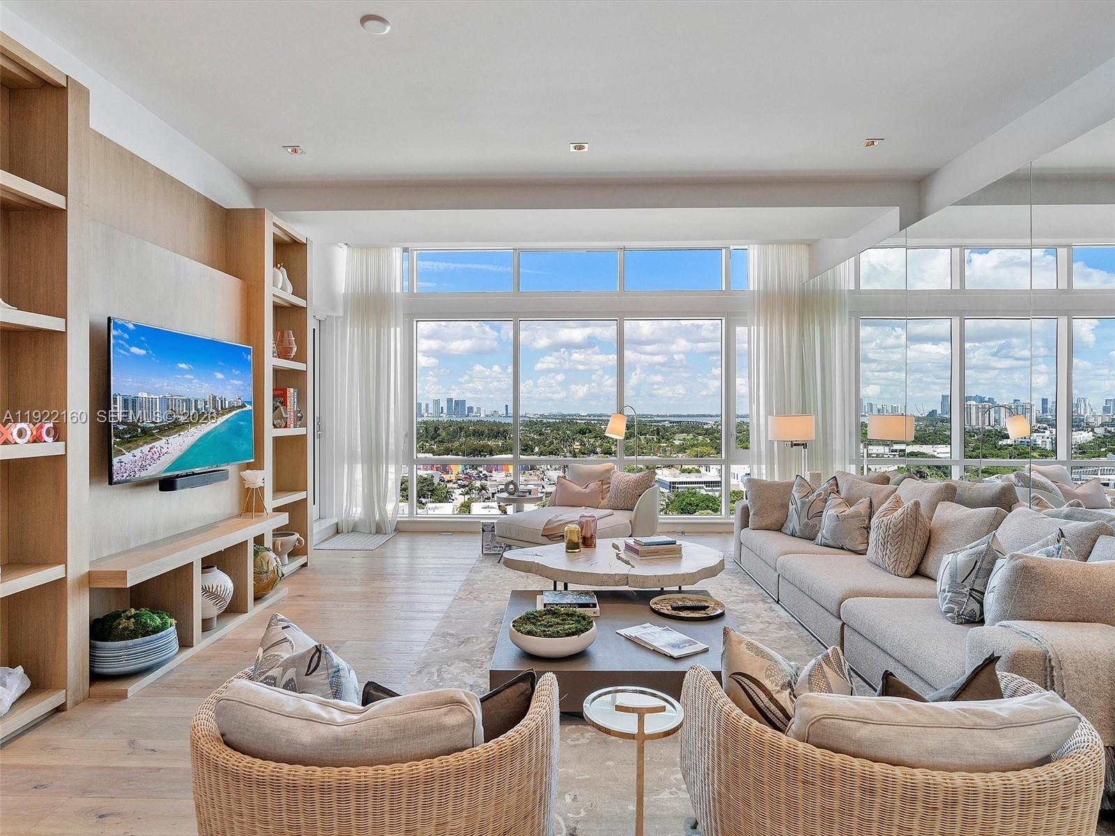 Experience elevated coastal living in this beautifully upgraded 2-bedroom, 2-bathroom penthouse at 1 Hotel & Homes South Beach—where exquisite design meets effortless luxury. Recently enhanced with new luxury flooring, custom designer wallpaper, motorized shades, and elegant Artefacto furnishings, this residence exudes sophistication at every turn. Sunlight pours through expansive windows, illuminating refined interiors and framing breathtaking panoramic views of the Miami skyline and shimmering coastline, creating a serene atmosphere that feels both inspiring and indulgent.

Step into a world where five-star resort living becomes your everyday. Enjoy a fully staffed lobby, 24-hour valet, dedicated concierge, and chauffeured house cars ready to take you anywhere you desire. Indulge in four oceanfront pools, four renowned restaurants, three lively bars, the acclaimed Bamford Wellness Spa, a state-of-the-art 14,000 sq. ft. Spartan Gym, and on-site SoulCycle—all just an elevator ride away.

Residents enjoy direct beach access, exclusive owner privileges, and a seamless blend of privacy and world-class service. Perfectly positioned in the heart of Miami Beach, this penthouse places you steps from premier dining, luxury shopping, upscale lounges, and iconic cultural events. A rare opportunity to experience the magic of 1 Hotel living from one of its most exceptional residences.