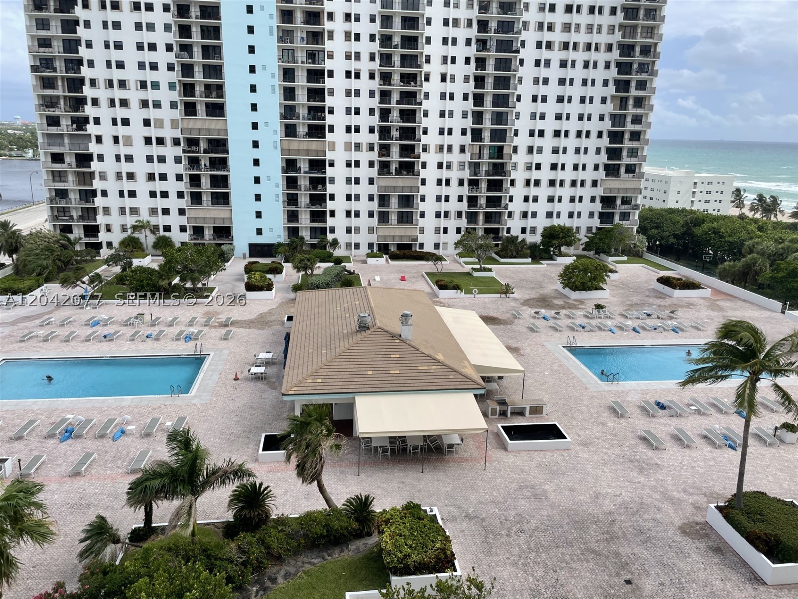 Looking for a seasonal rental in a social and friendly community that offers everything that you could want?  Then look no further than this 2BR/2BA oceanfront condo in the Summit on Hollywood Beach.  Enjoy views both of the ocean and of the intracoastal.  This condo is totally tiled and features impact glass, an elongated balcony, split bedrooms, a remodeled kitchen, a washer/dryer in the unit and covered garage parking.  Walk onto the beach or stroll on the broadwalk or enjoy the community amenities which include a large pool deck with an on site restaurant & barbecue area, tennis, basketball, game rooms and social gatherings.  A perfect place to enjoy Florida's best months.